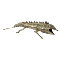 Apribottiglie a forma di iguana articolata di metà secolo in argento con il marchio Castillo