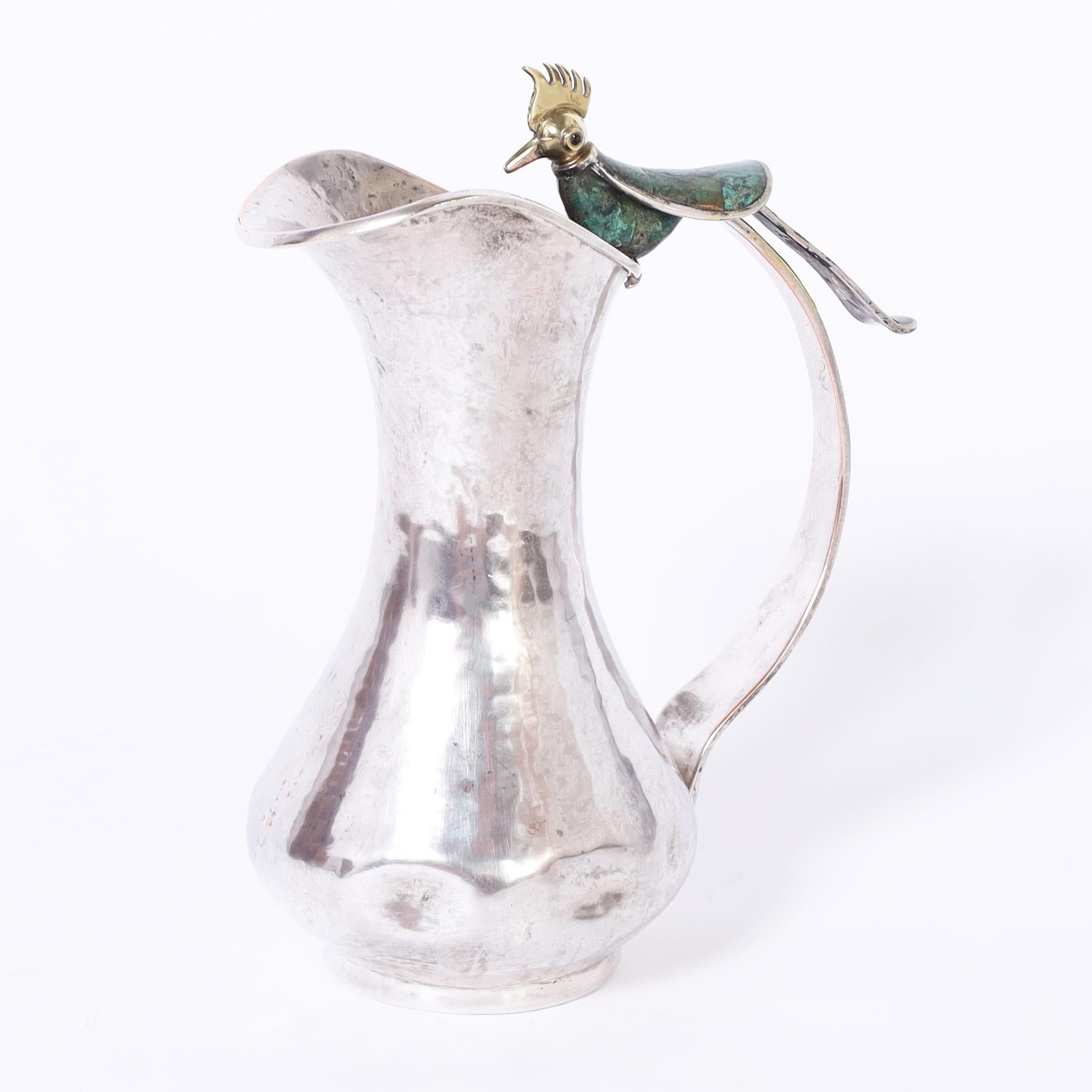 Hammered Mid Century Silver Plate Pitcher with Bird by Los Castillo For Sale