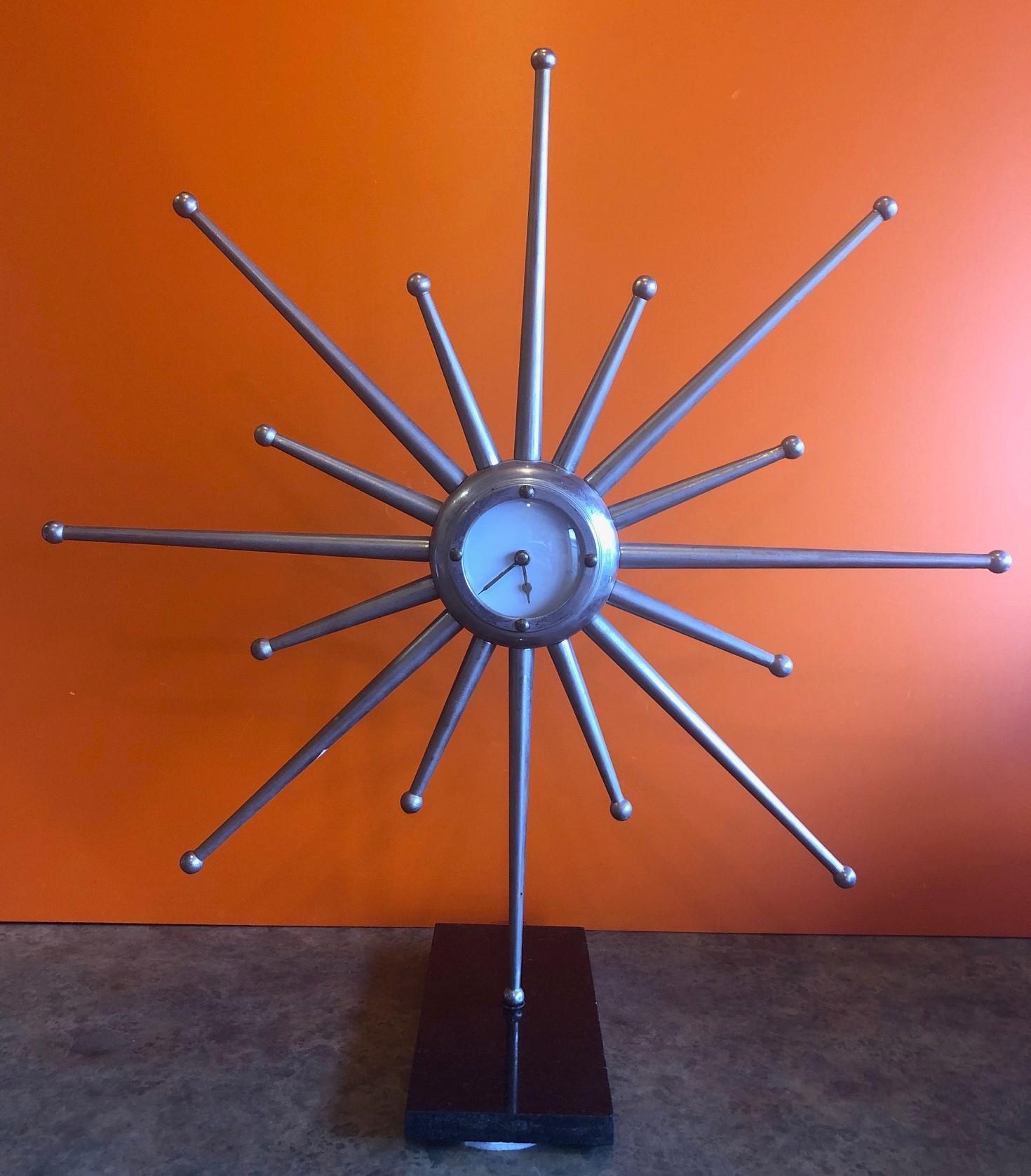 silver sunburst clock