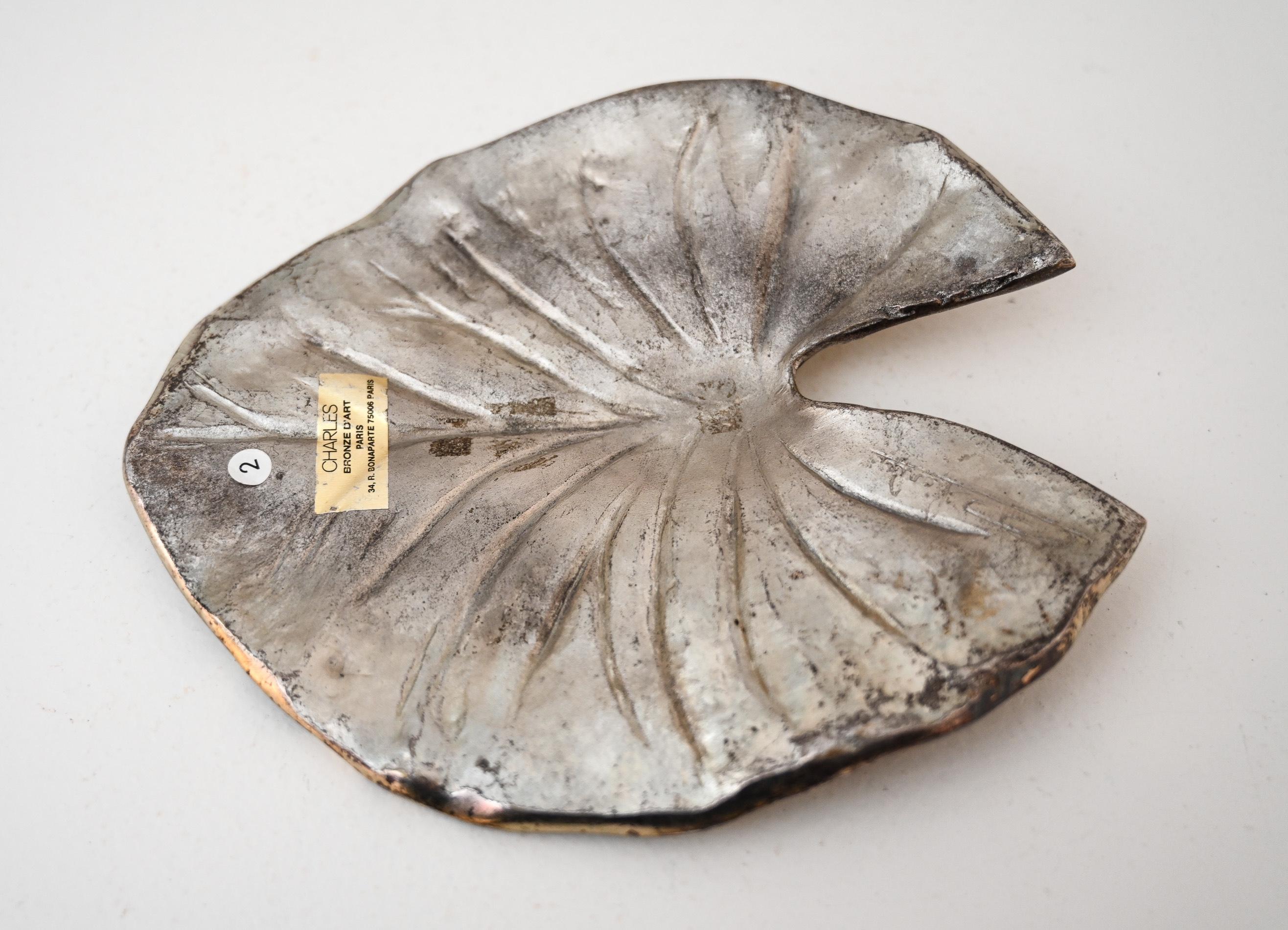 Silvered bronze Lily leaf by Chrystaine Charles signed, paper Charles Bronze D’Art label.

By Maison Charles, Paris circa 1970.

Provenance Galerie Chrystaine Charles, Rue Bonaparte Paris.