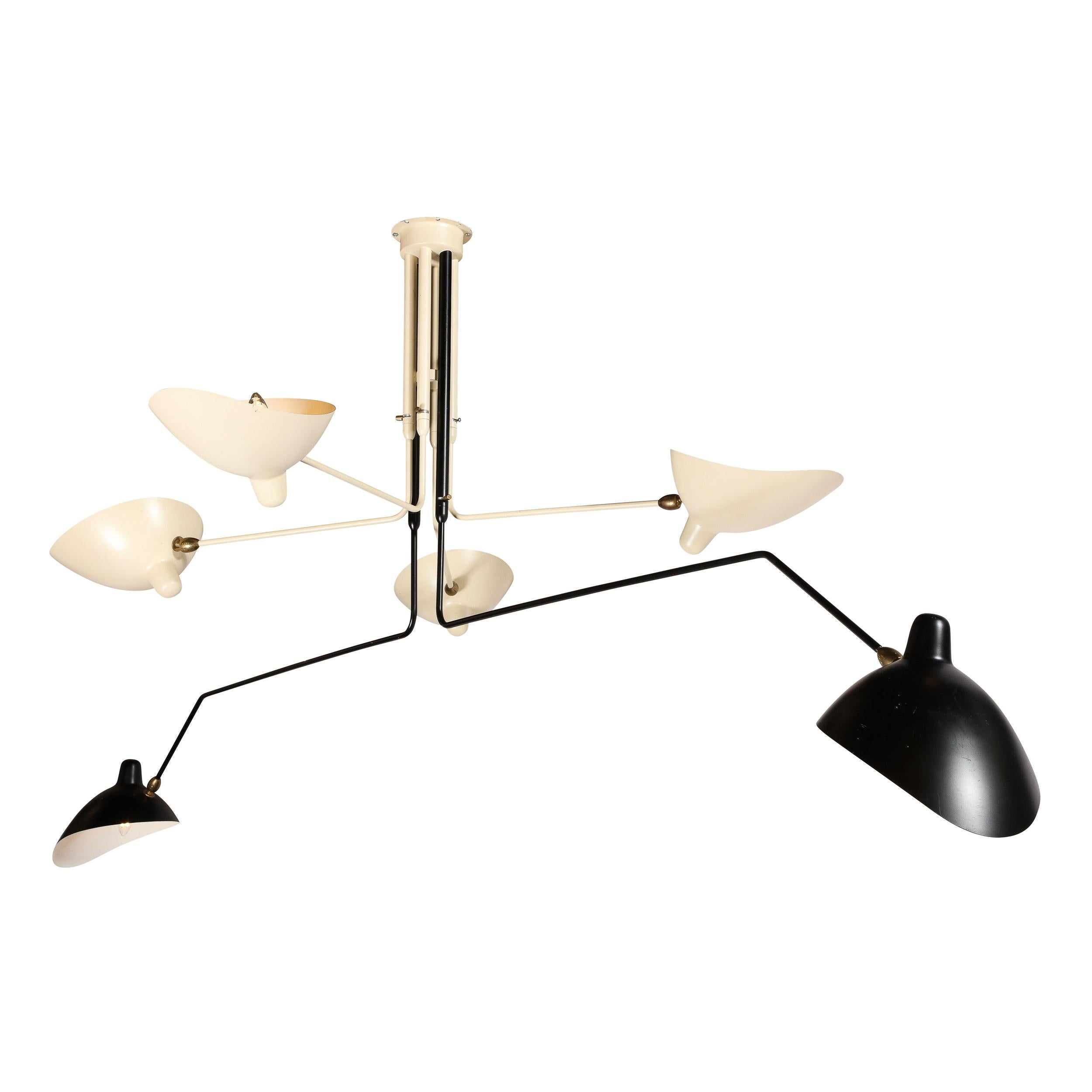 This highly elegant and expansive Mid-Century Modernist Six Arm Articulating Chandelier in Black and White Enamel with Brass Fittings is made by the esteemed designer and metalworker Serge Mouille, originating from France in 1958. This piece
