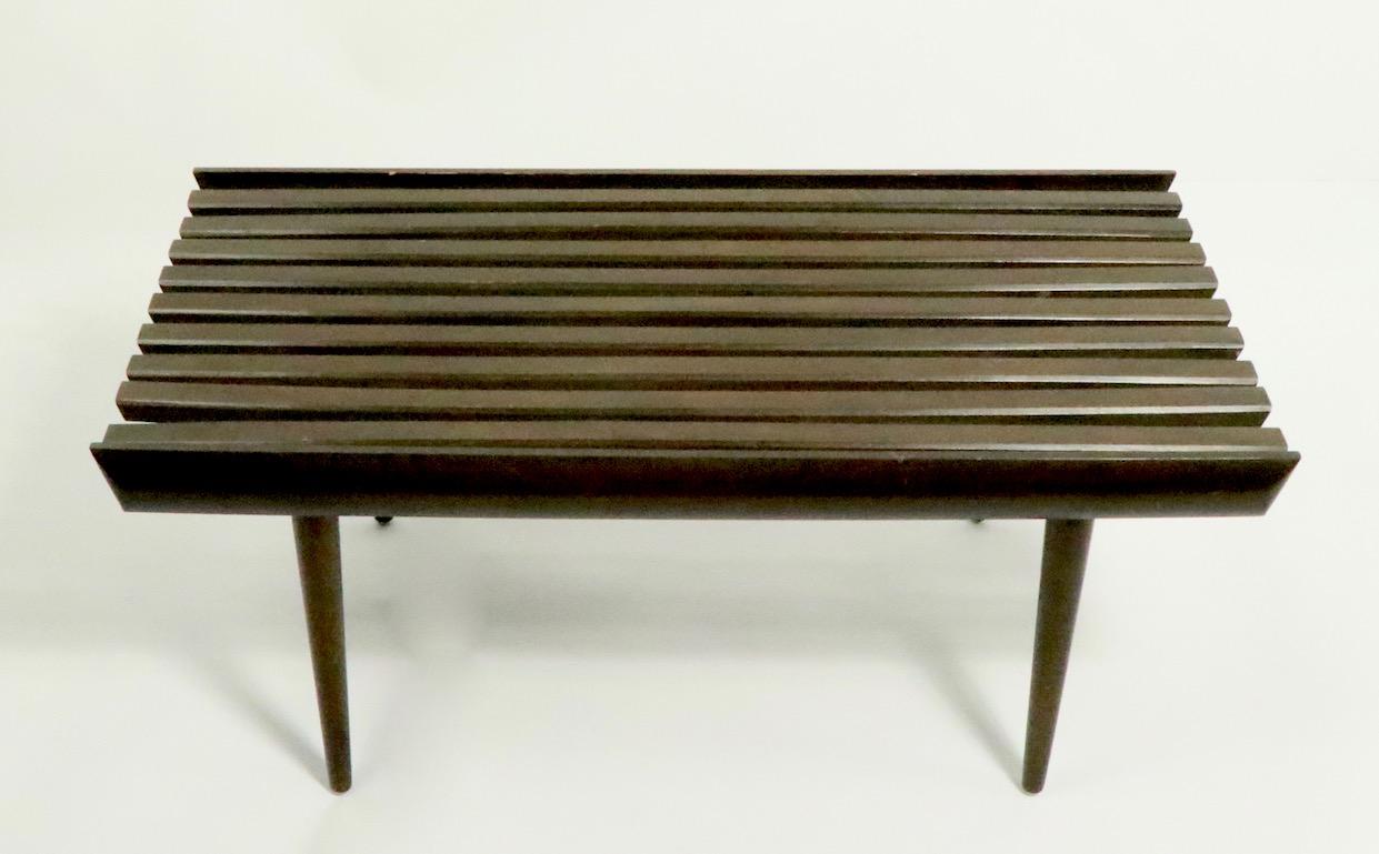 Iconic mid century  slat bench, coffee table, on diminutive scale. This example is in very good original condition, showing only light cosmetic wear, and slight variations in shape of slats, normal and consistent with age.