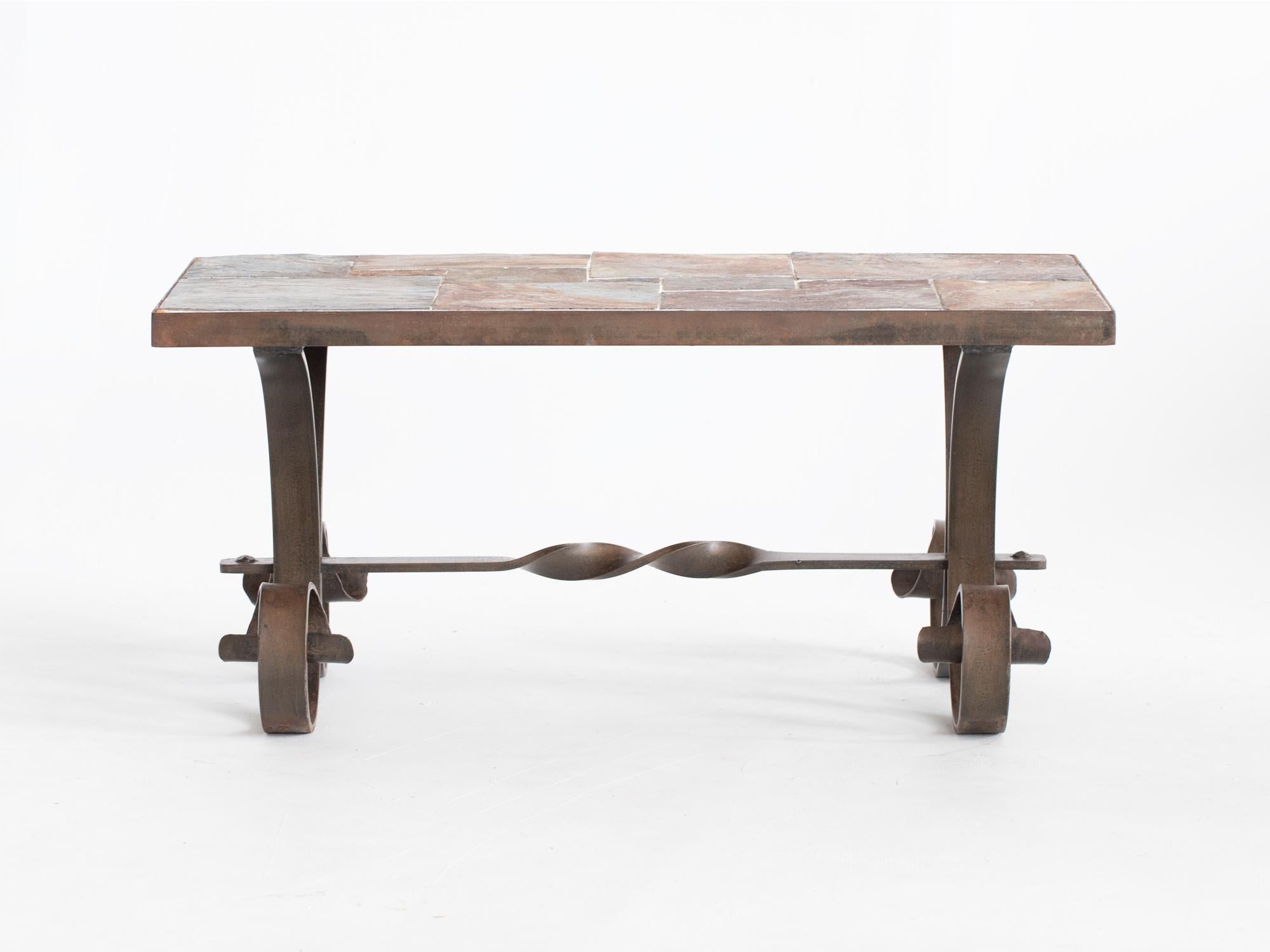 A mid century slate and wrought iron coffee table. French, mid 20C.

Stock ref. #2388

A heavy and solid piece. Patinated iron surface with undamaged tiles.

45 x 97 x 48.5 cm

17.7 x 38.2 x 19.1 