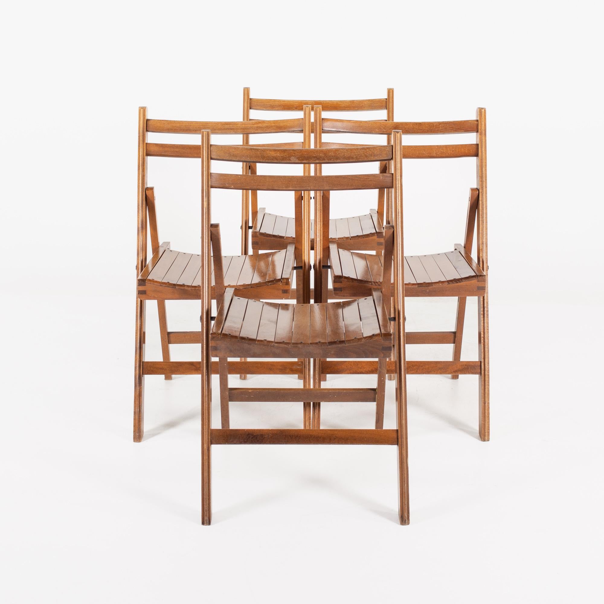 Mid century Slatted folding dining chairs - set of 4

Each chair measures: 18 wide x 21 deep x 31 inches high, with a seat height of 18.5 inches

All pieces of furniture can be had in what we call restored vintage condition. That means the piece
