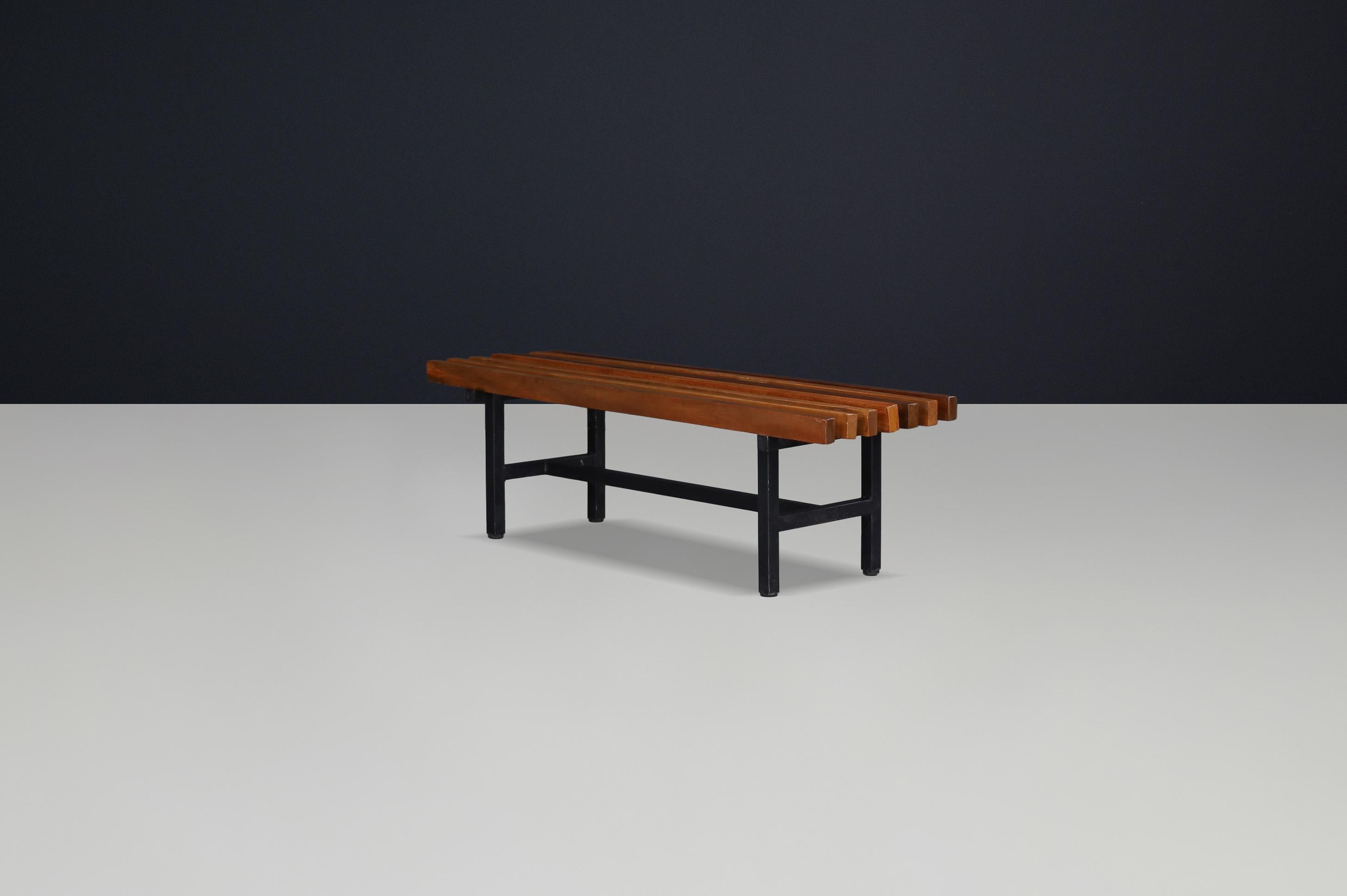 Mid-Century Slatted Teak and Metal Frame Bench, Italy, 1960s

This elegant mid-century bench from Italy, dating to the 1960s, combines a striking slatted teak top with a sturdy black-lacquered metal frame. The design balances industrial precision