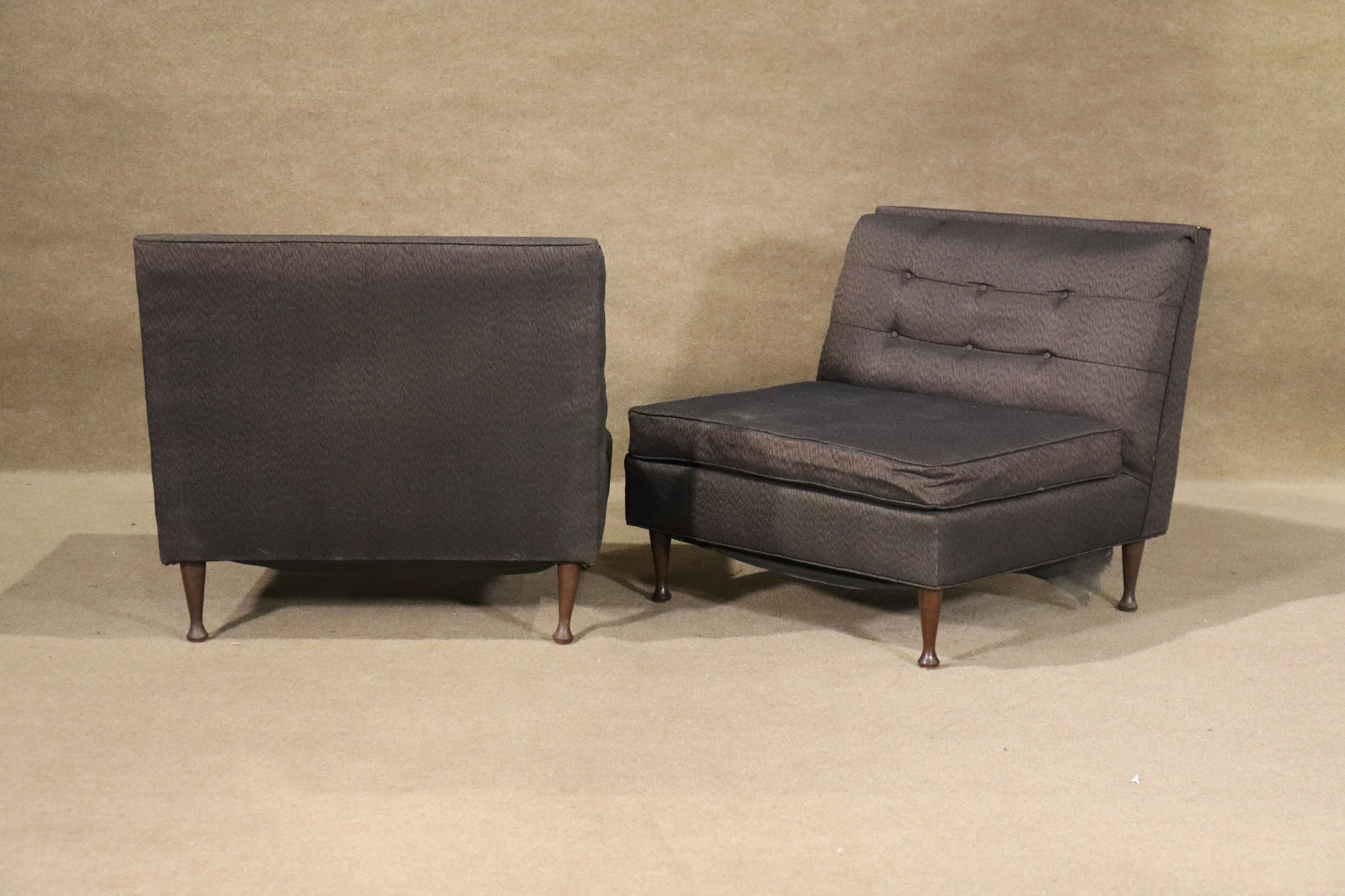 Pair of mid-century modern low profile slipper chairs. Tufted backs and short wood legs.
Please confirm location NY or NJ