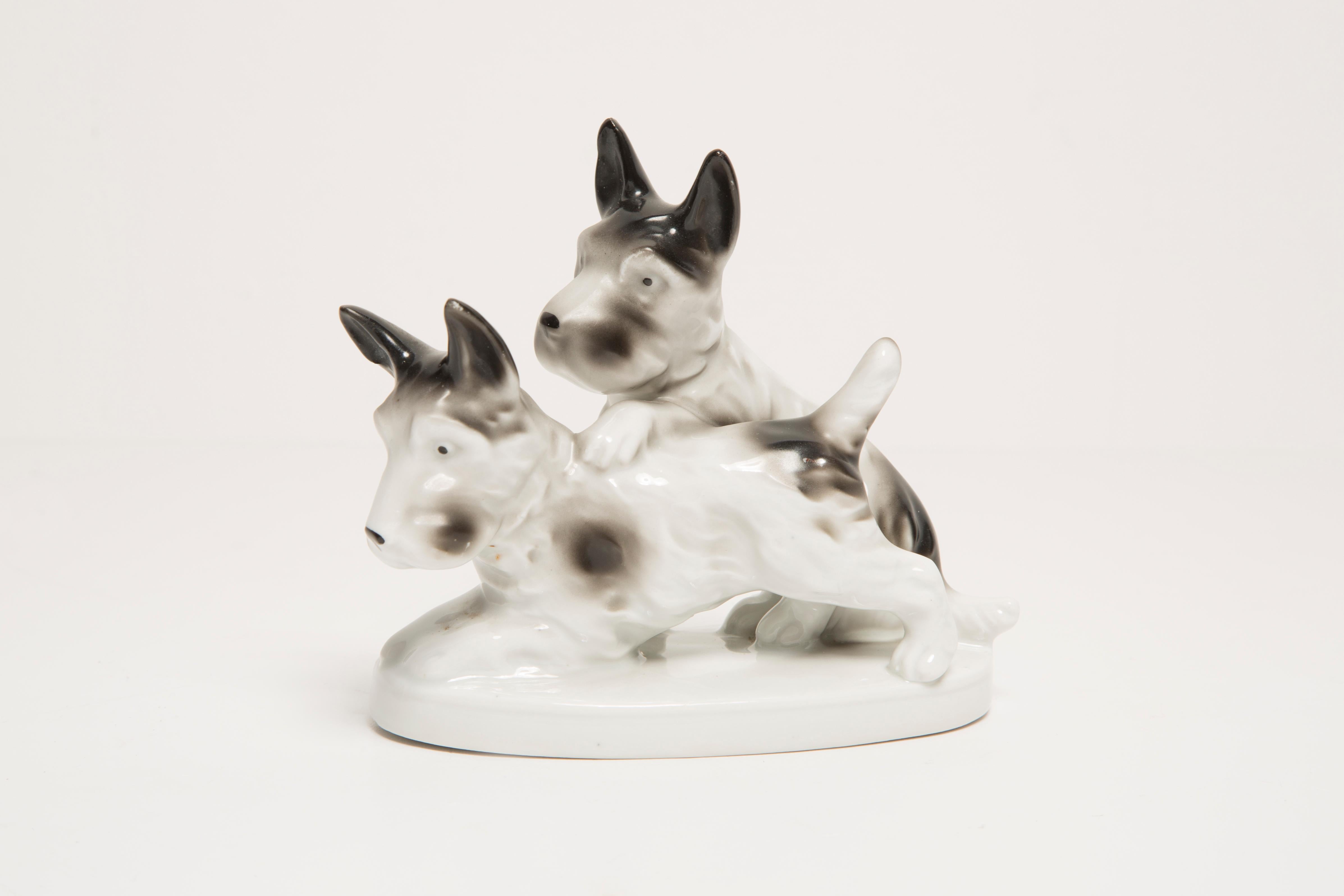 Painted ceramic, very good original vintage condition. No damages or cracks. Beautiful and unique decorative sculpture. Small Dogs Sculpture was produced in Italy. Only one item available.