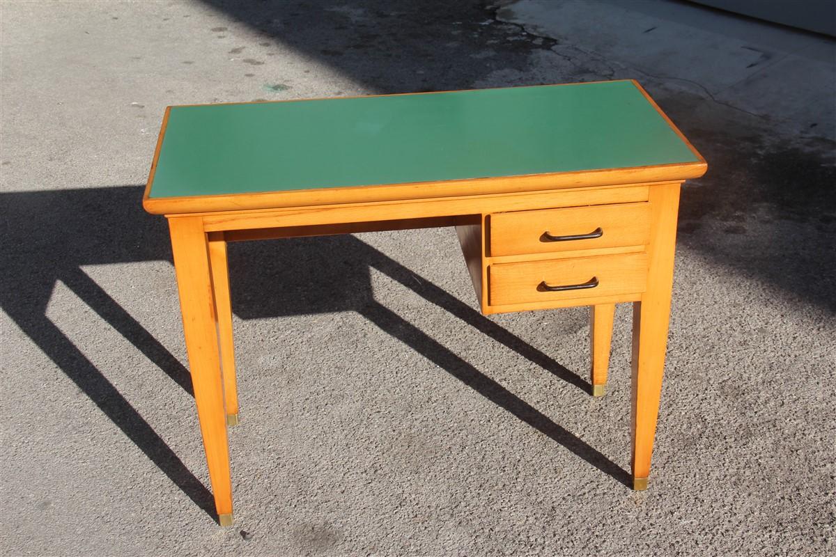 Midcentury small desk in beechwood with green laminate top Italian design brass foot.