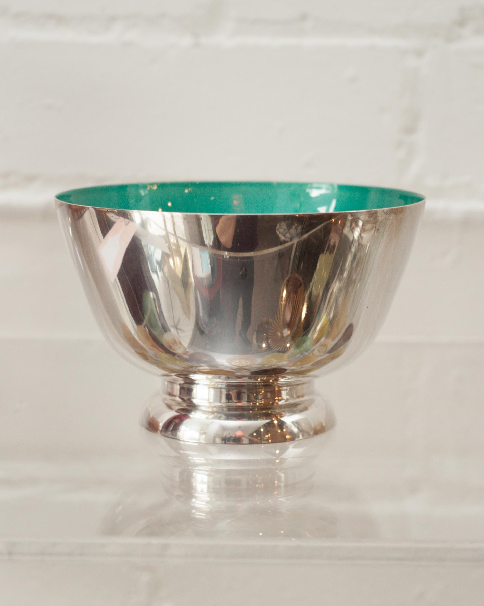 A beautiful mid-century sterling silver bowl with turquoise blue enamel lining. This Revere style bowl is perfect for fruits, candies, nuts. Due to the vibrant interior colour, this vessel is a beautiful empty as filled.