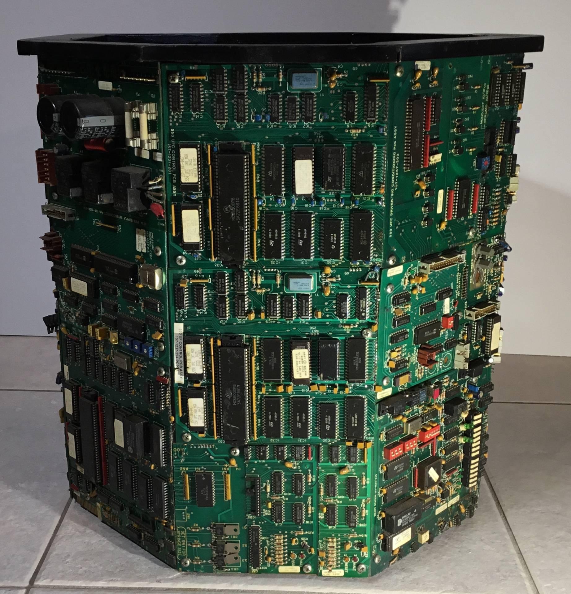 One of a kind coffee table made of wood frame, all eight sides artistically covered by vintage electronic mother boards from the 1987,with components like chips from Philips and Harris, resistances ,capacitor. The top and inside is painted in back,