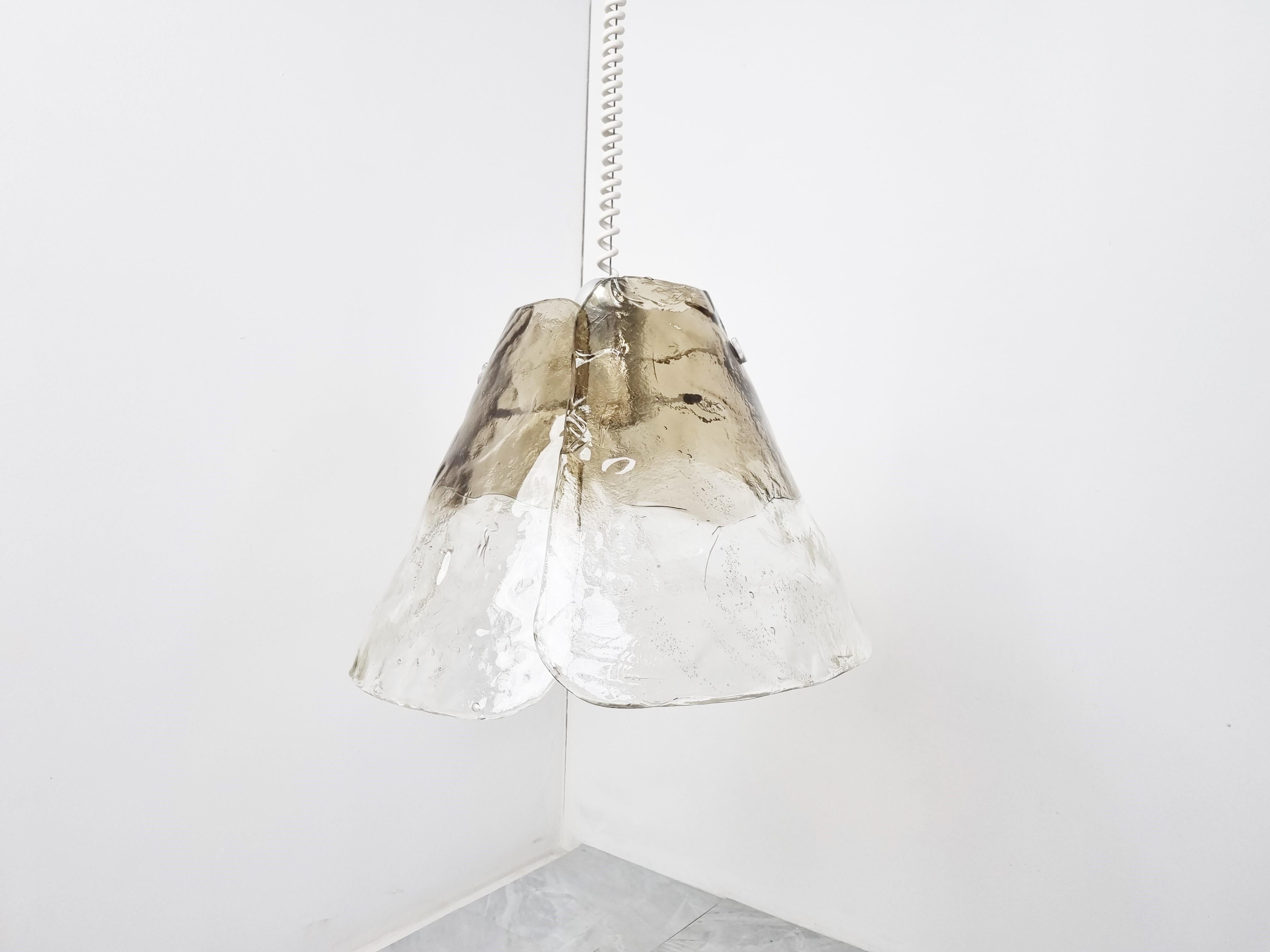 Mid century smoked glass pendant light by JT Kalmar for Franken KG.

This lamp was inspired by Carlo Nason who designed similar lamps for Mazzega.

The hand made smoked glass shades create a warm diffuse light.

Works with a single E27 light