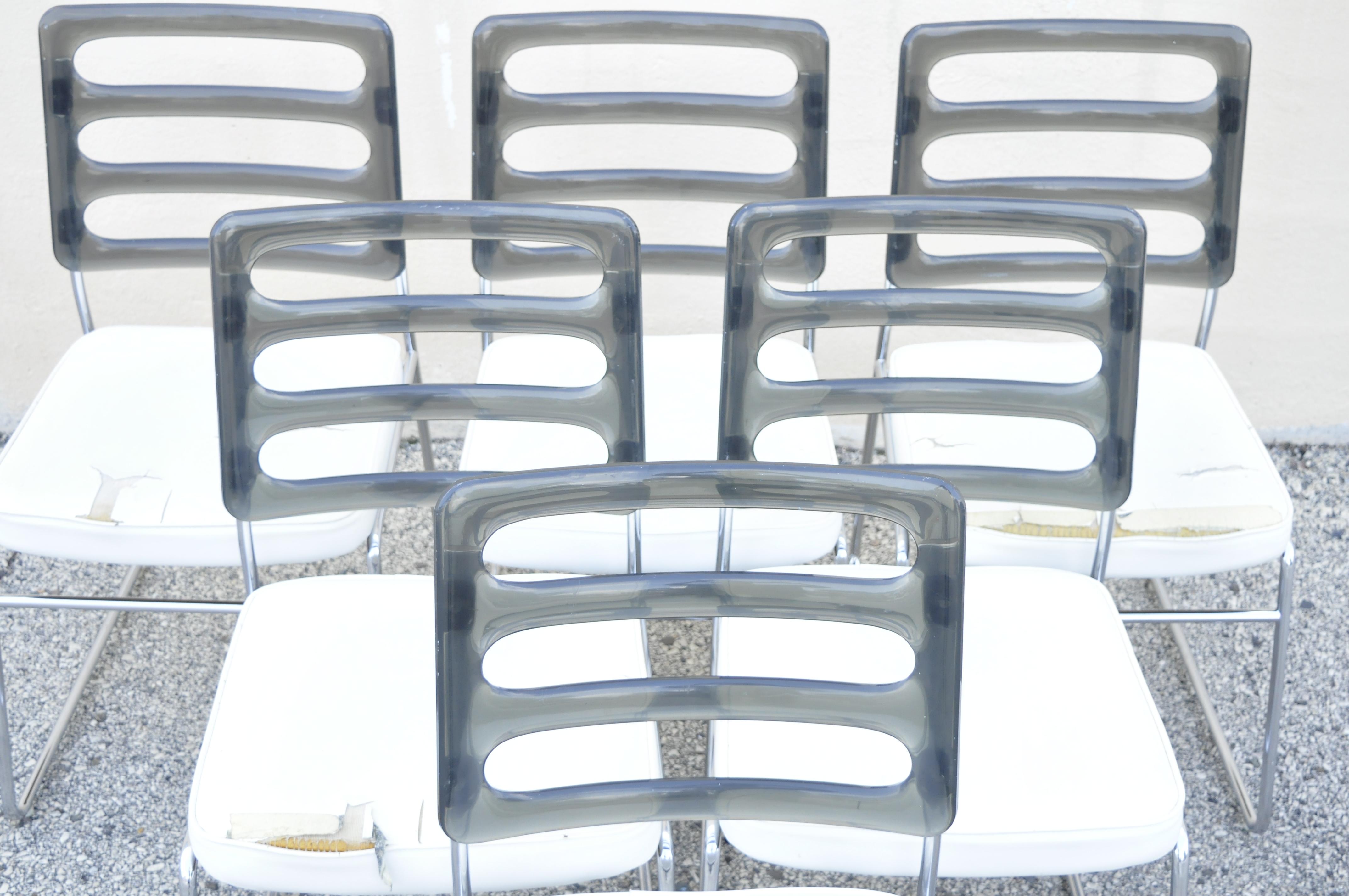 Mid-Century Modern Ssmoked Lucite back chrome frame base dining chairs - set of 6. Set includes (6) side chairs, smoked lucite backs, chrome metal frames, white naugahyde seats, very nice vintage set, clean modernist lines, great style and form.