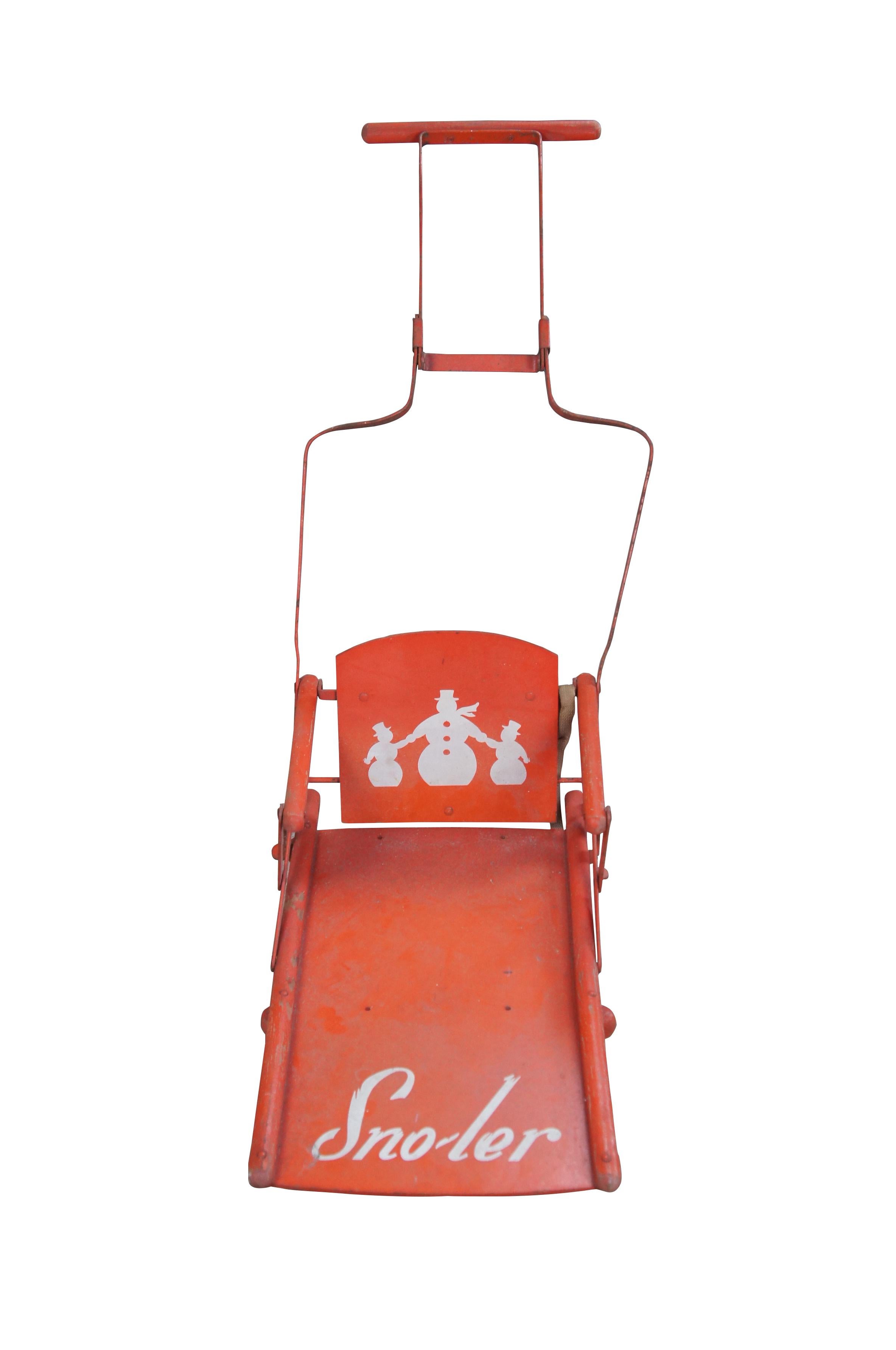 Vintage Sno-ler push sled, circa 1940s-1950s. Made from wood with metal frame. Features a folding design allowing for ease of storage.