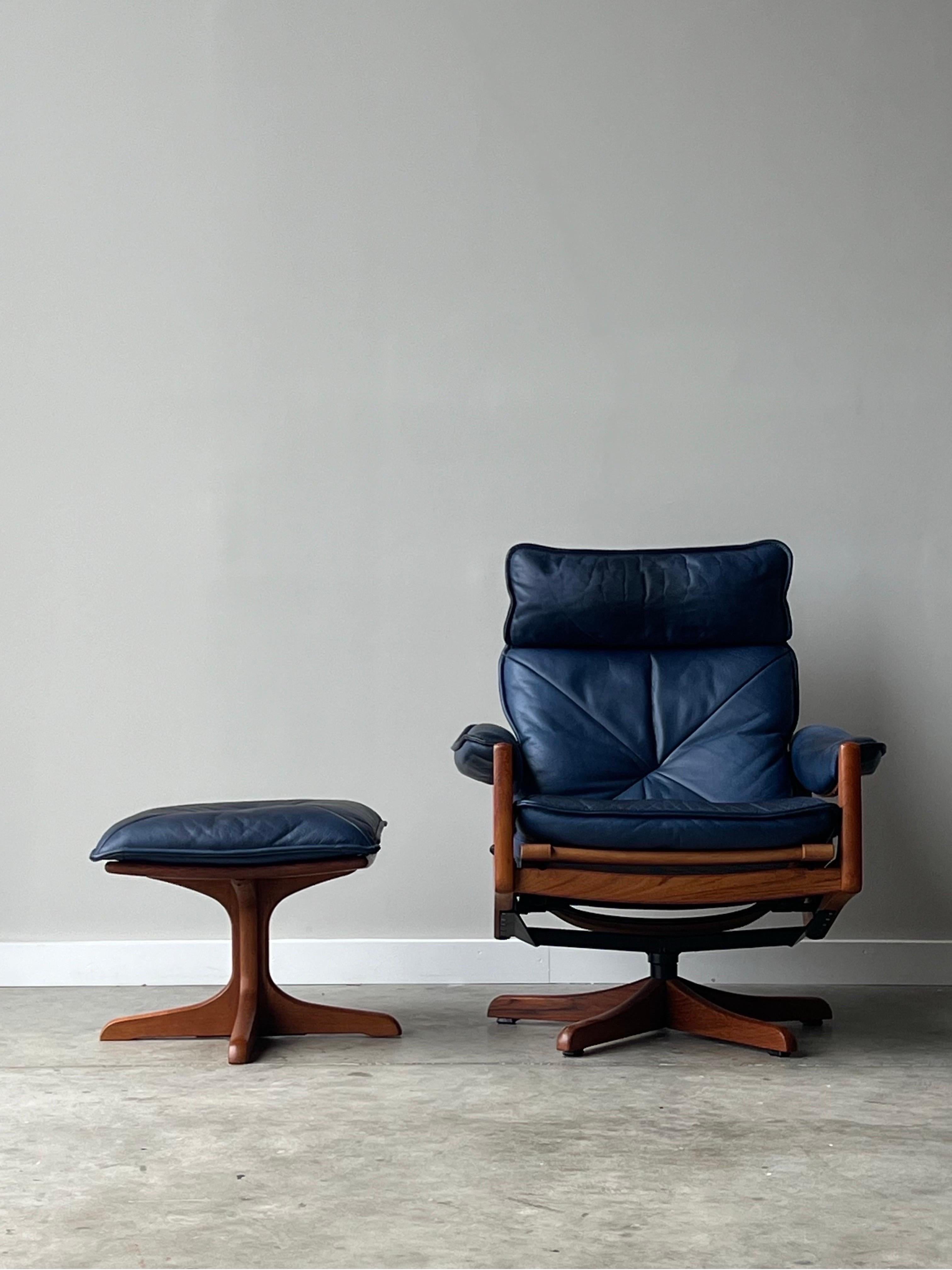 Mid Century Norwegian Soda Galvano Teak Blue Leather Reclining Lounge and Ottoman. This lounge is beautifully constructed of teak wood and mechanized to reclining through a lever system. Perfectly worn in blue leather with appropriate patina from