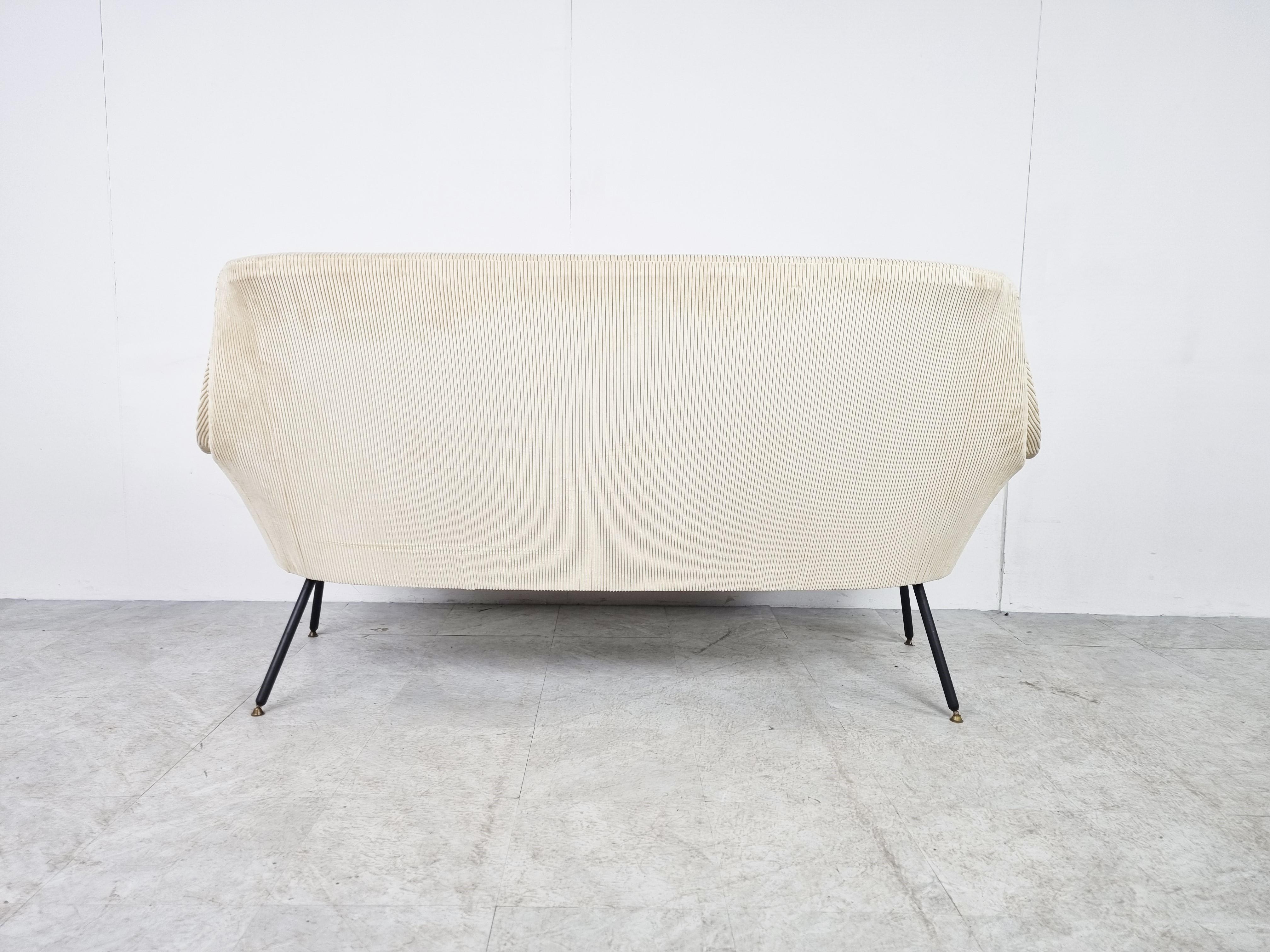 Striking mid century two seater sofa.

It has been reupholstered in white and pink fabric.

Typical and elegant 1950s design.

1950s - Belgium

Very good condition, like new.

Dimensions:
Bench:
Height: 88cm/34.64