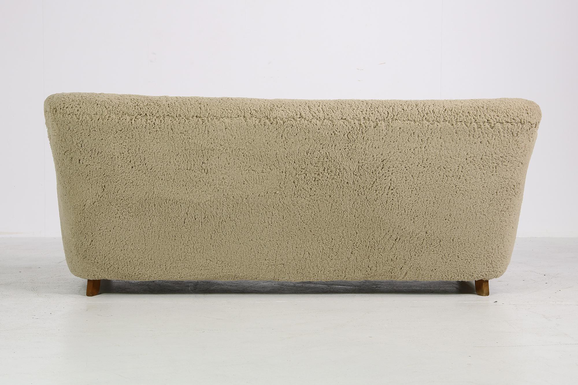 Beautiful authentic midcentury sofa. Purchased in the early 1950s in Denmark, design attributed to Mogens Lassen or Thorald Madsen, heavy weight piece, completely restored, reupholstered in old school style, covered with great teddy fur fabric, like