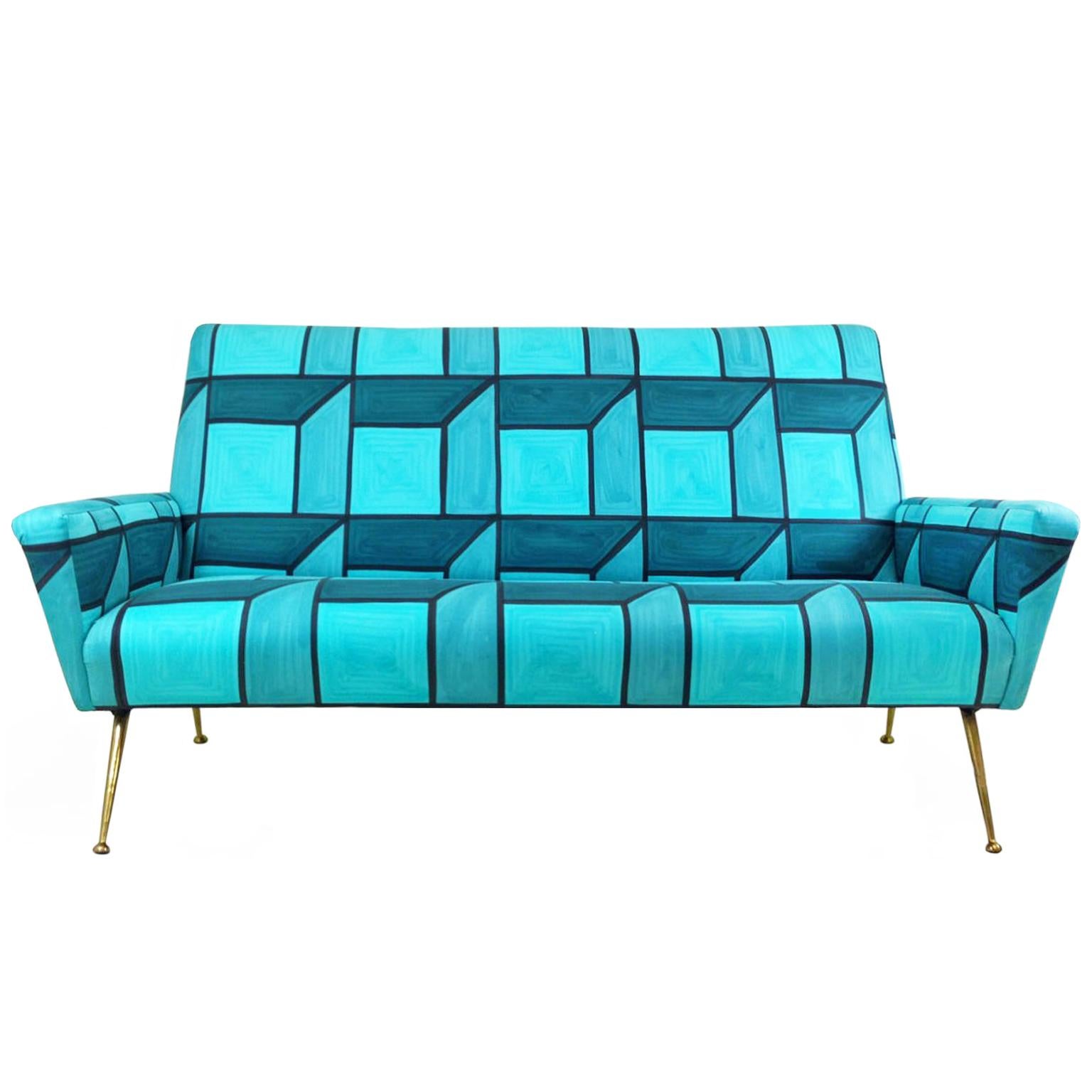 Mid-Century Italian brass leg sofa in the style of Gio Ponti, upholstered in hand-painted blue cube fabric by Livio de Simone, Italy, 1950s-2015.