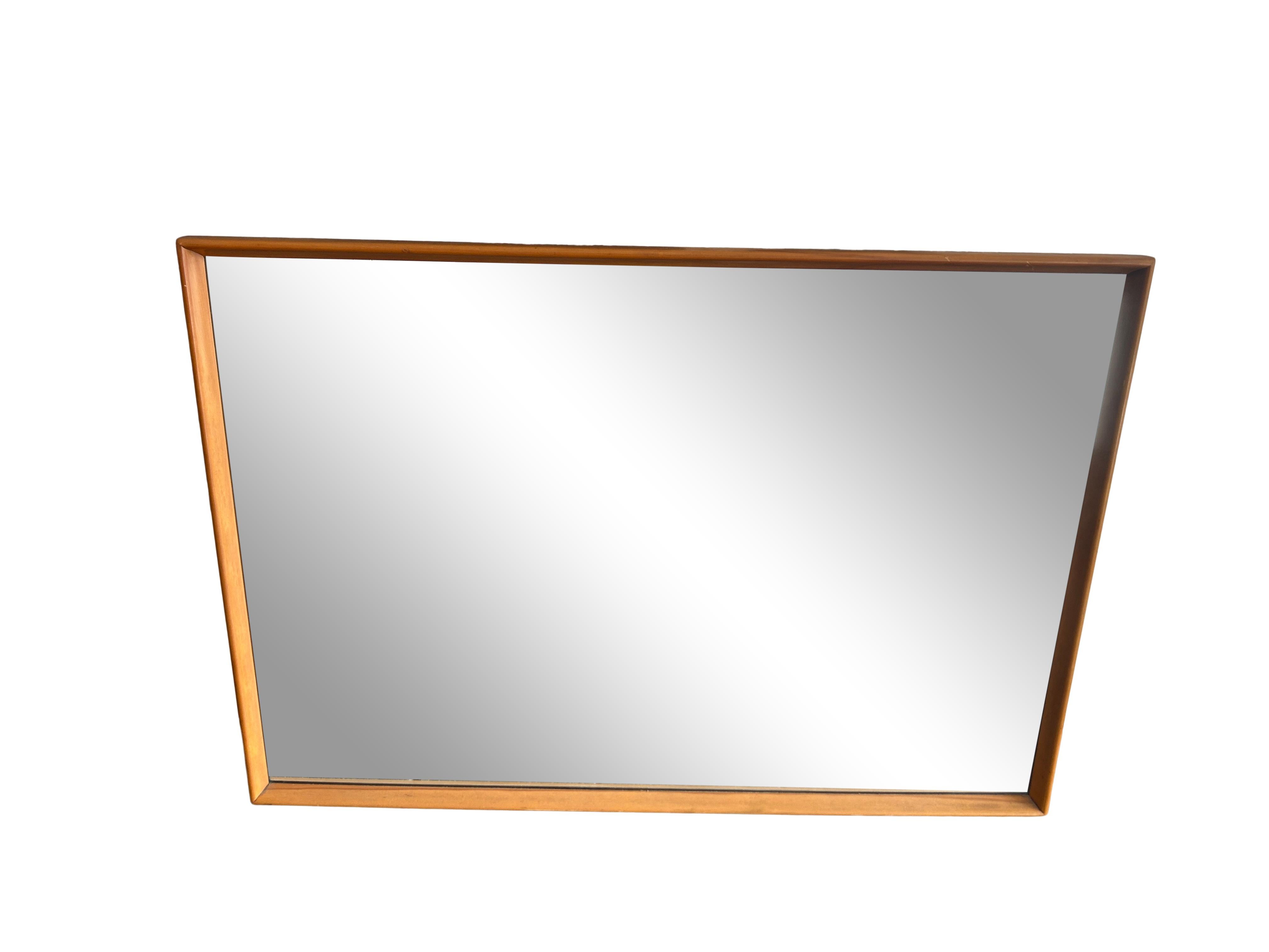 Great Mid-Century Modern wall mirror solid maple blonde finish with rounded shape. Very nicely made mirror by Heywood Wakefield. Made in USA. Located in Brooklyn NYC.

Measures 52” x 36” x 1.5” deep.