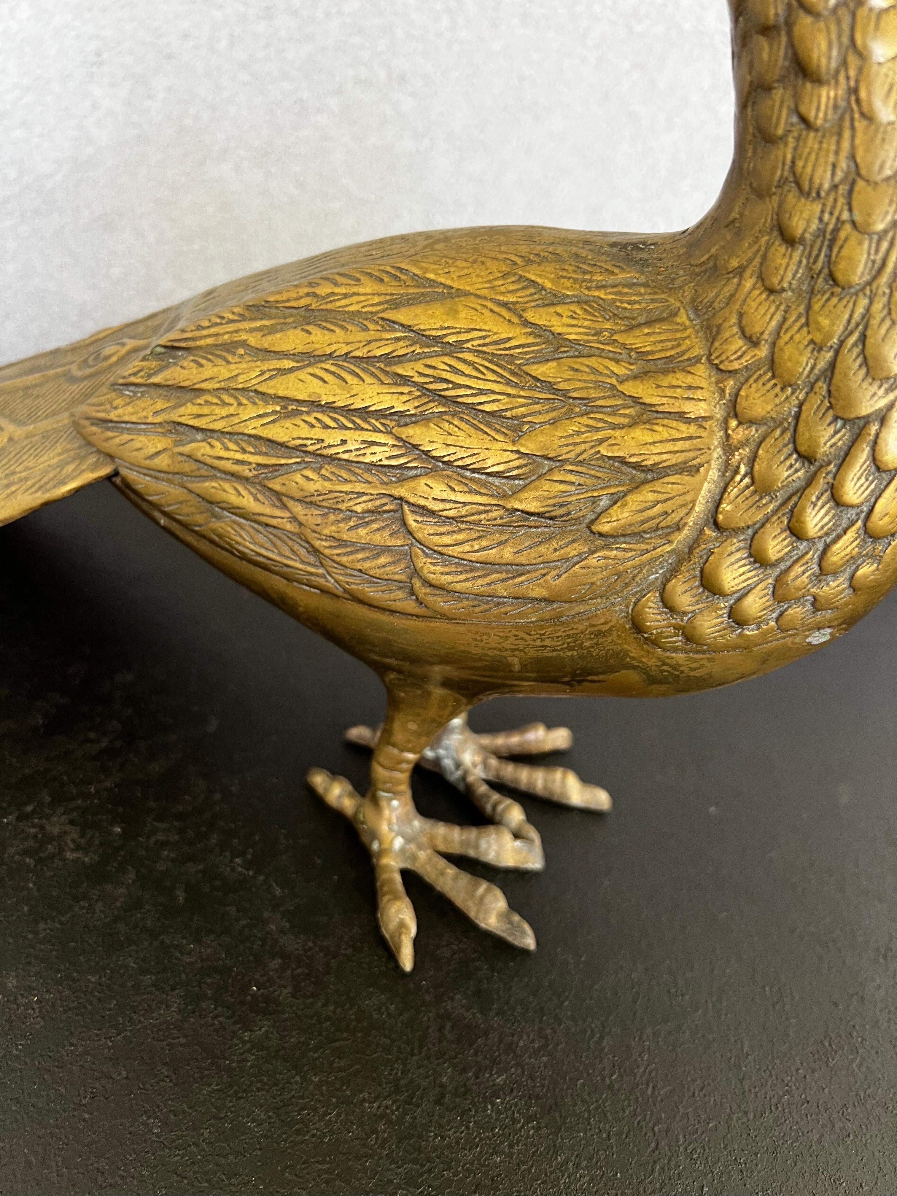 Stunning single peacock made of heavy solid brass. measures an impressive 22