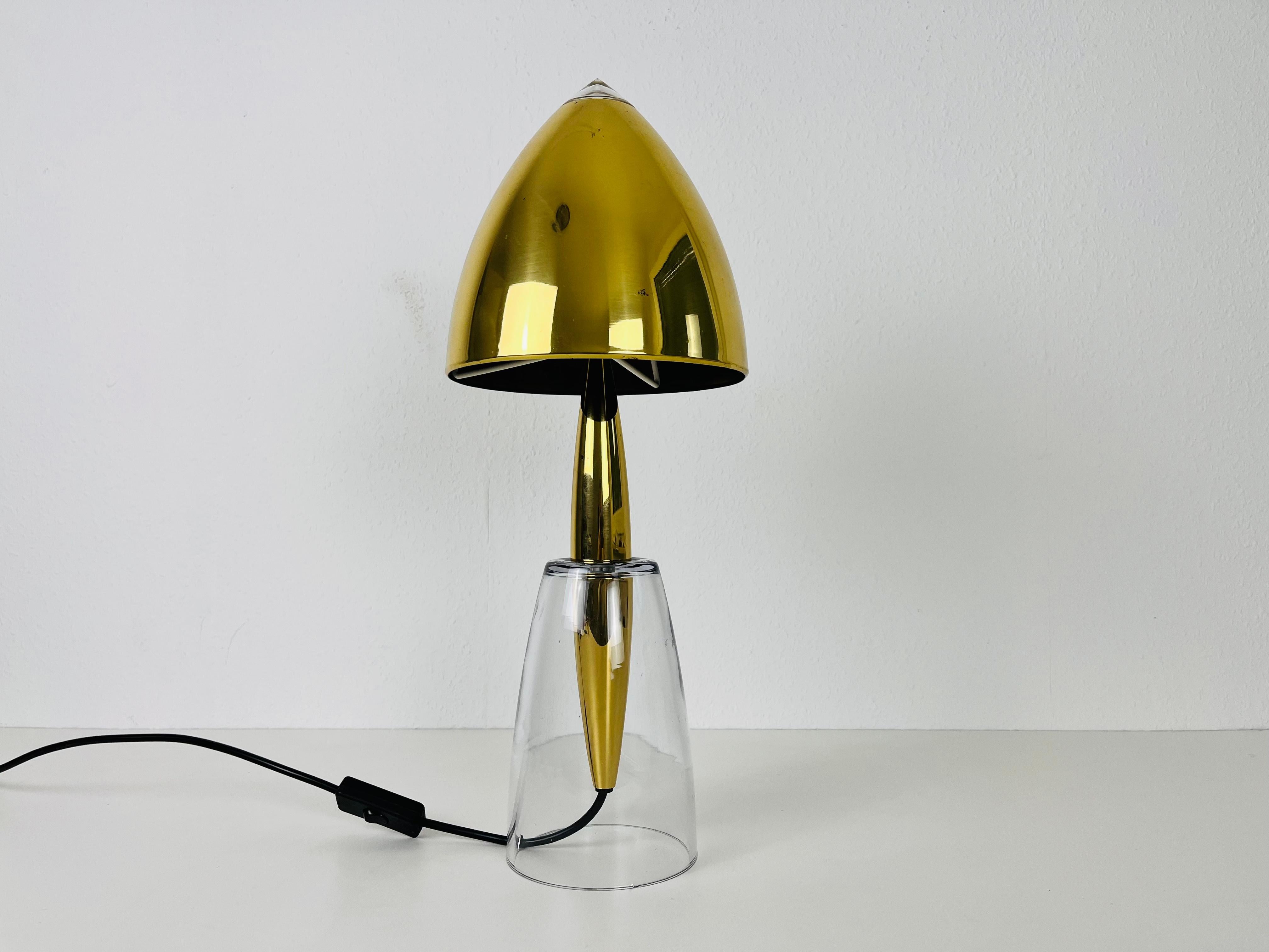 A beautiful large table lamp made in the 1960s. The base is made of solid glass. The lamp shade is made of brass

The light requires one E27 light bulb. Works with both 120/220 V. Good vintage condition.

Free worldwide express shipping.