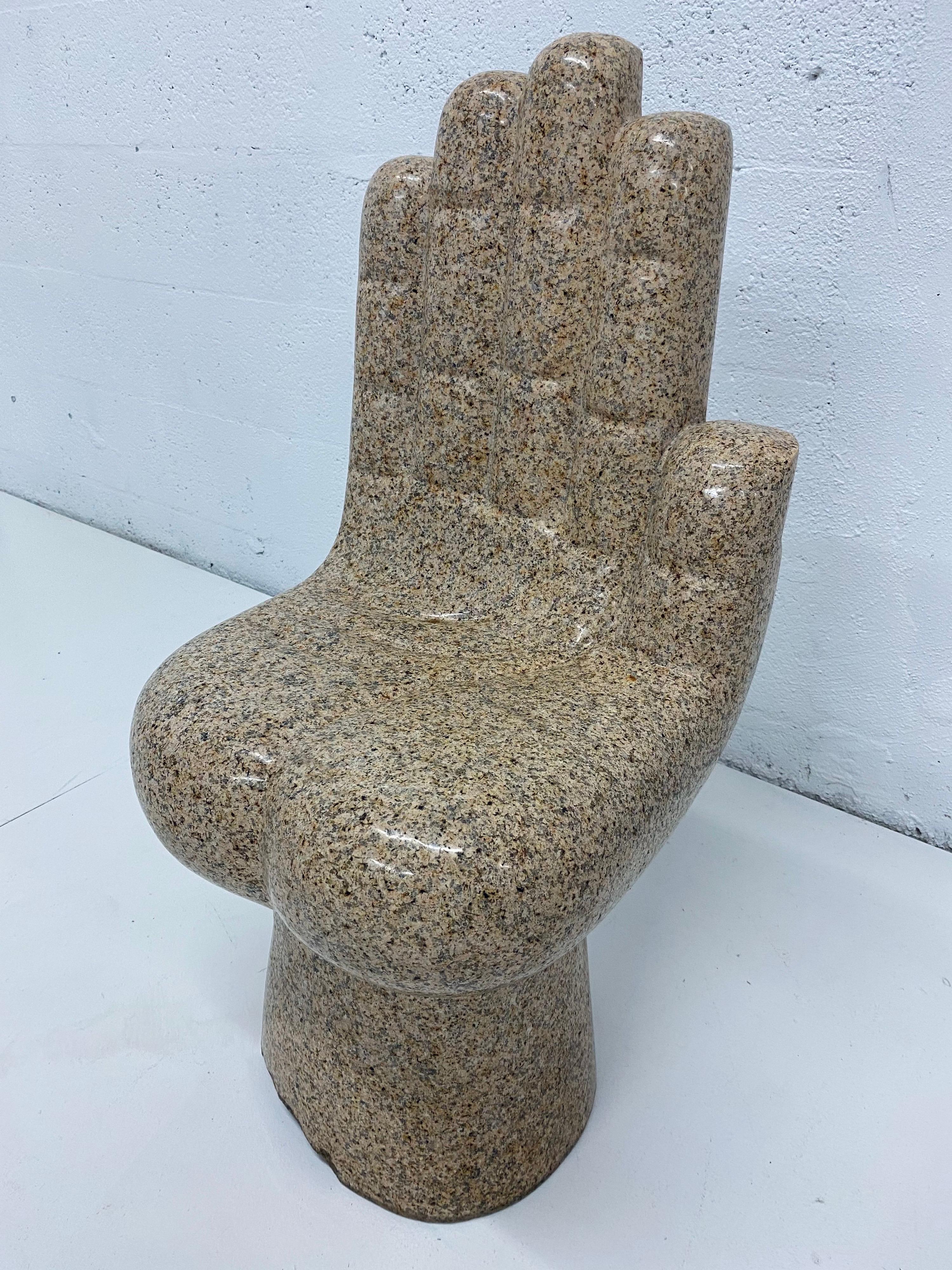 Mid-century outdoor / indoor chair made from a solid block of granite and hand carved to resemble a hand. Most likely inspired by the Pedro Friedeberg Hand Chair. Weighs 200lbs.