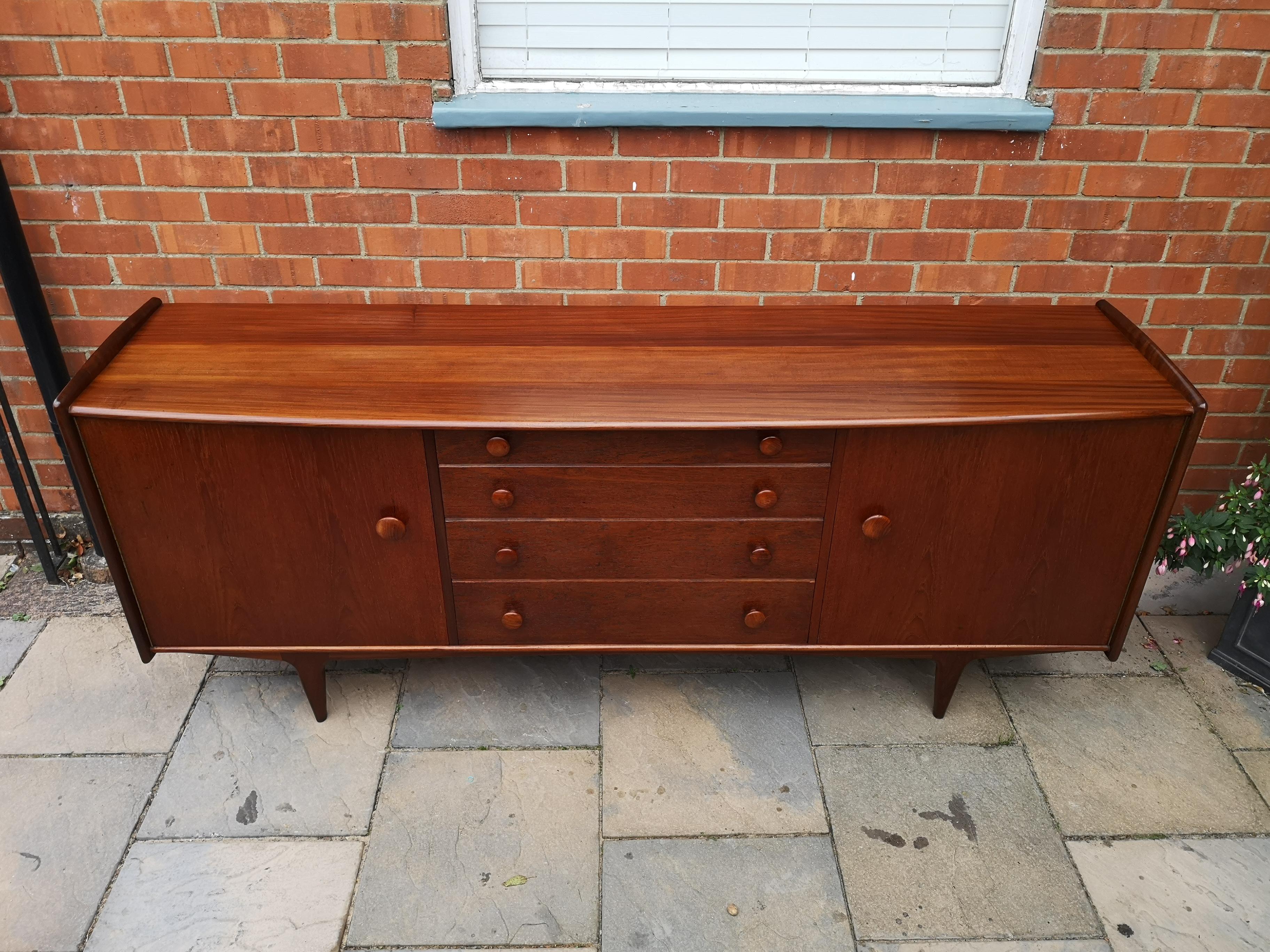 Stunning midcentury solid teak and Afromosia sideboard by John Herbert for A Younger Ltd, Scotland. Very good vintage condition with some signs of use as expected.