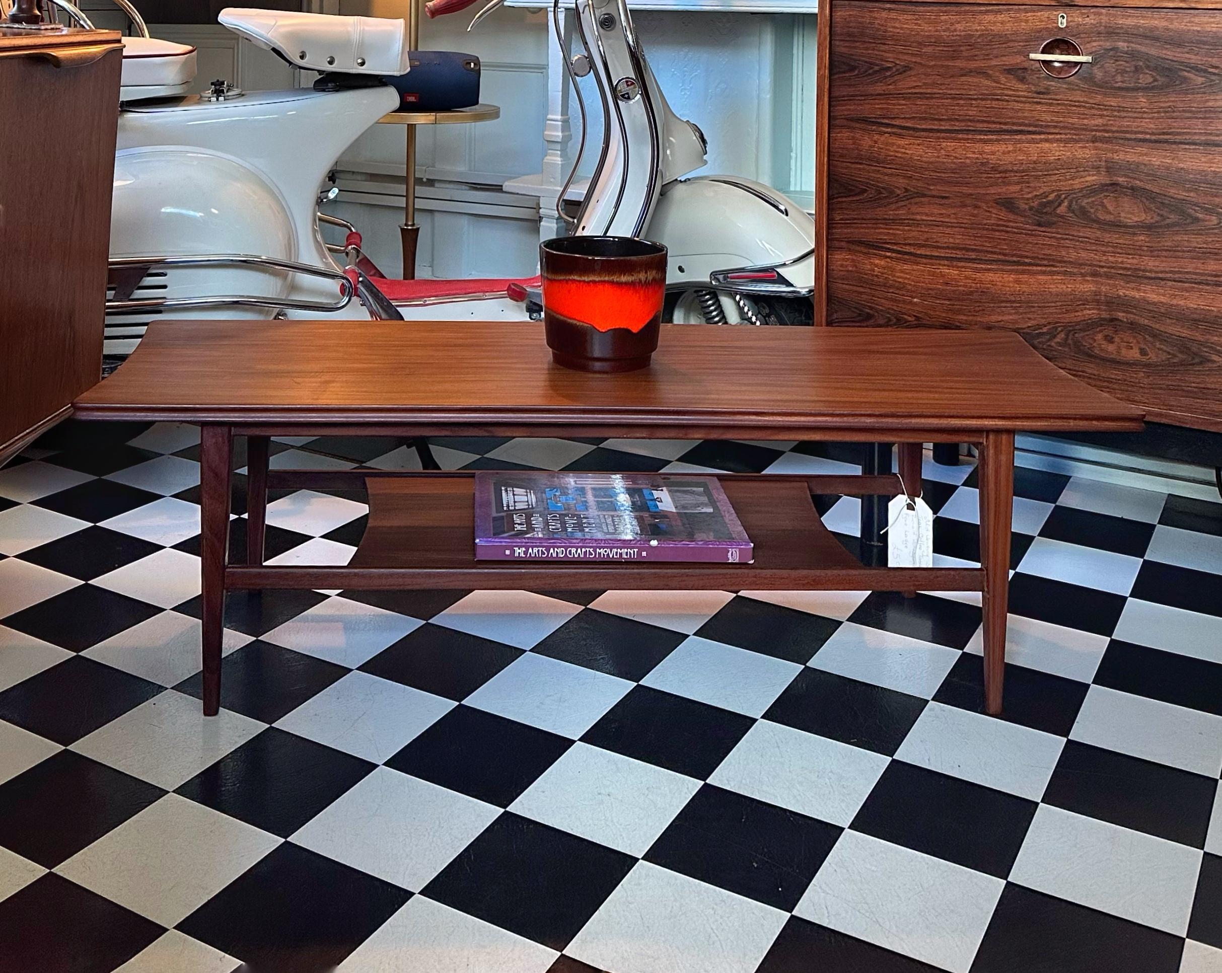 We’re happy to provide our own competitive shipping quotes with trusted couriers. Please message us with your postcode for a more accurate price. Thank you.

Very rare mid-century solid teak coffee table with magazine shelf by Richard Hornby for