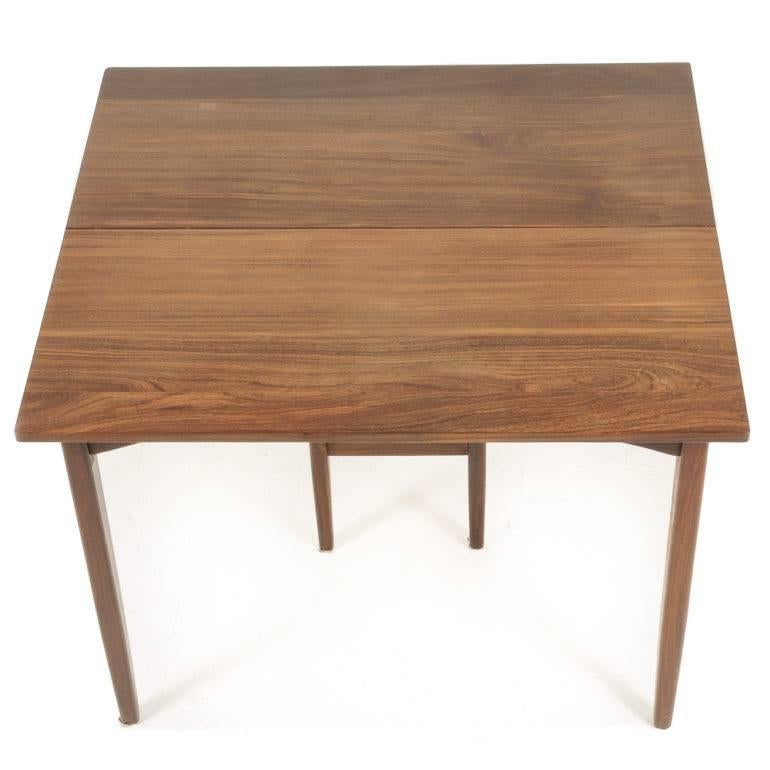 A nice-quality, simple, Mid-Century Modern dining table with three leaves, and unusual in its solid teak, rather than typical veneered particle board, circa 1960–1970.

Measures: 40 wide x 36 deep x 29 tall. 3 x 20 leaves.

40 wide by 96 long