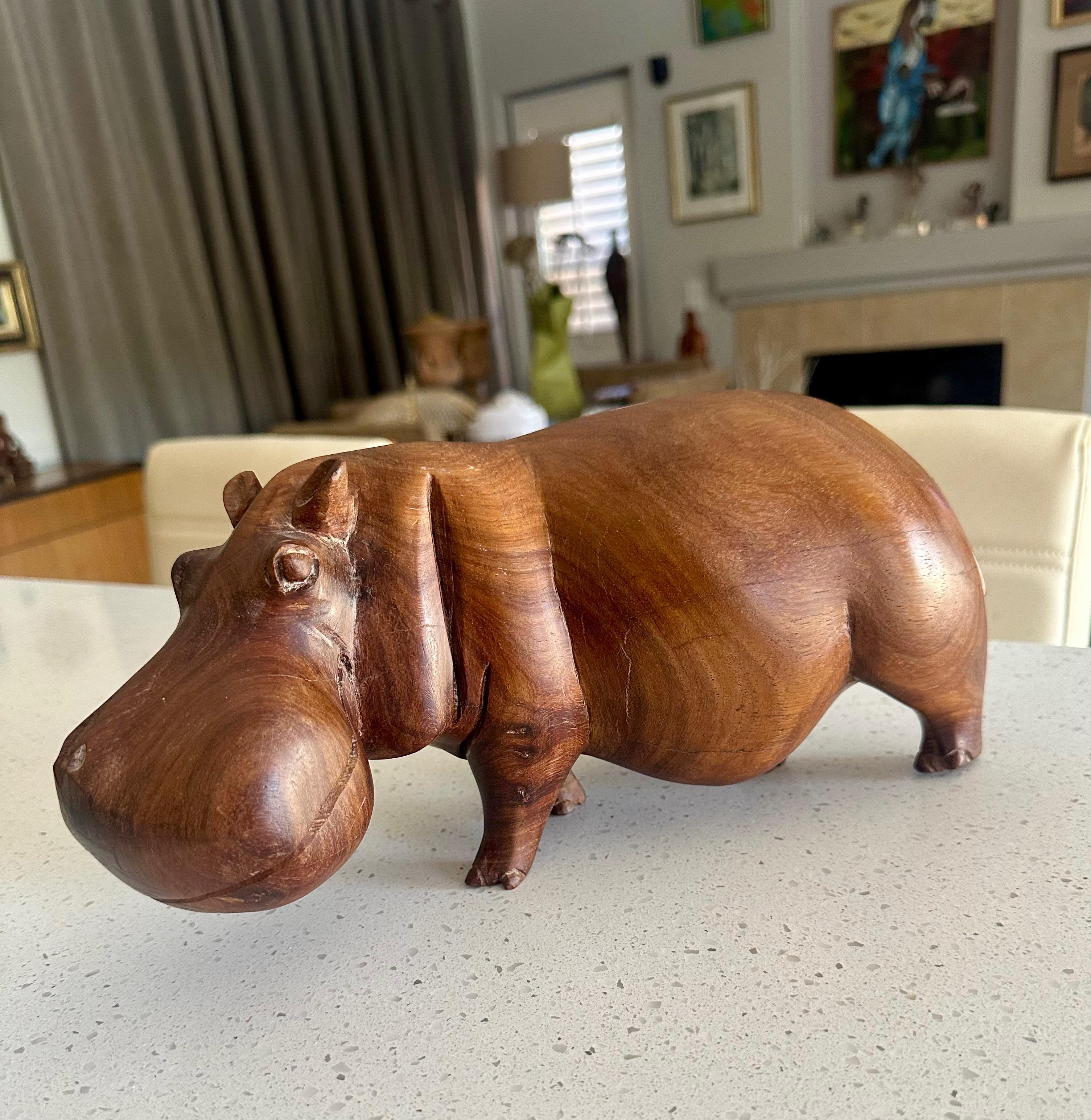 Large hand carved solid teak wood hippopotamus or hippo sculpture, exudes warmth and whimsy, mid century 1960c era.