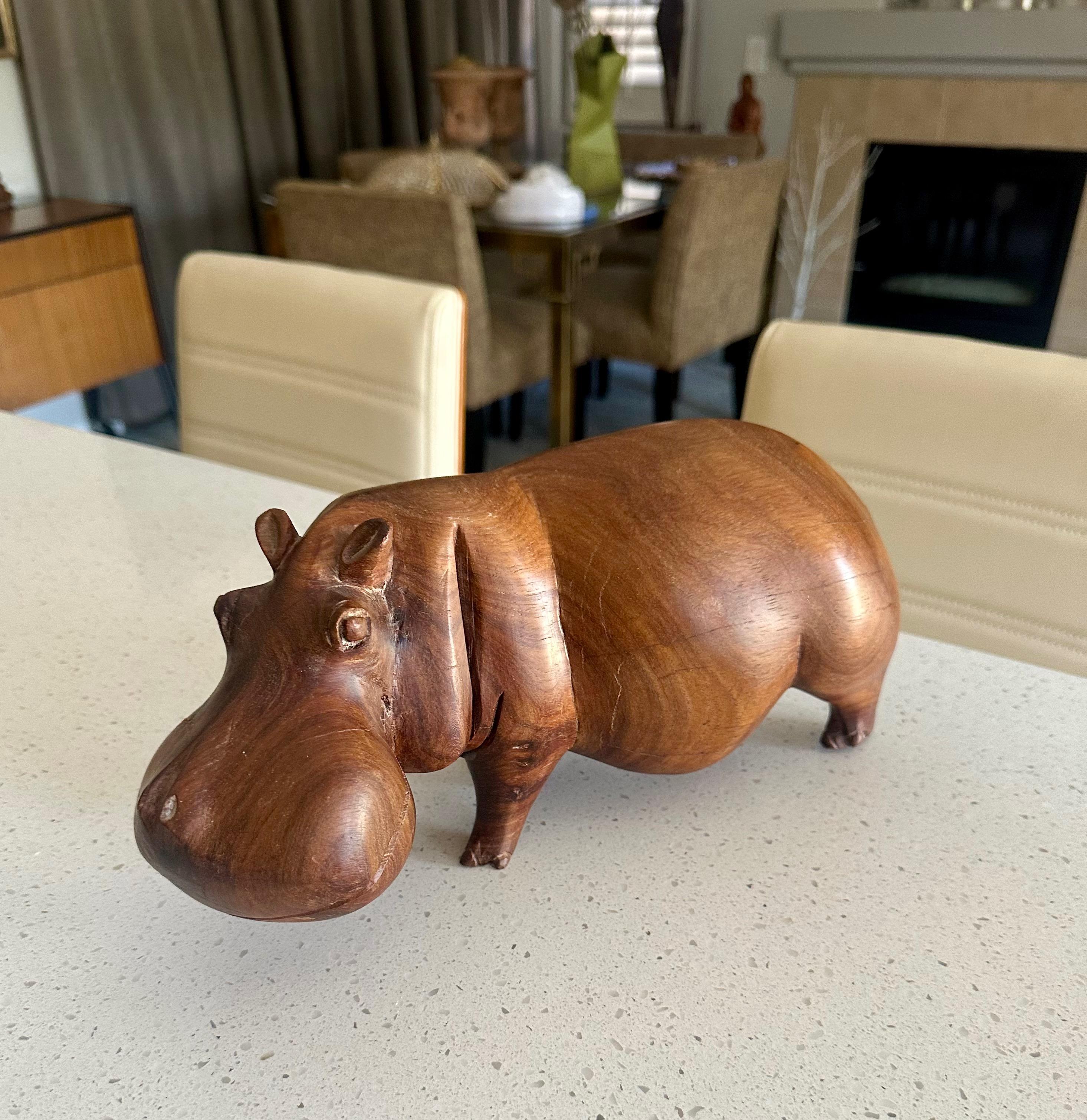 Large hand carved solid teak wood hippopotamus or hippo sculpture, exudes warmth and whimsy, mid century 1960c era.