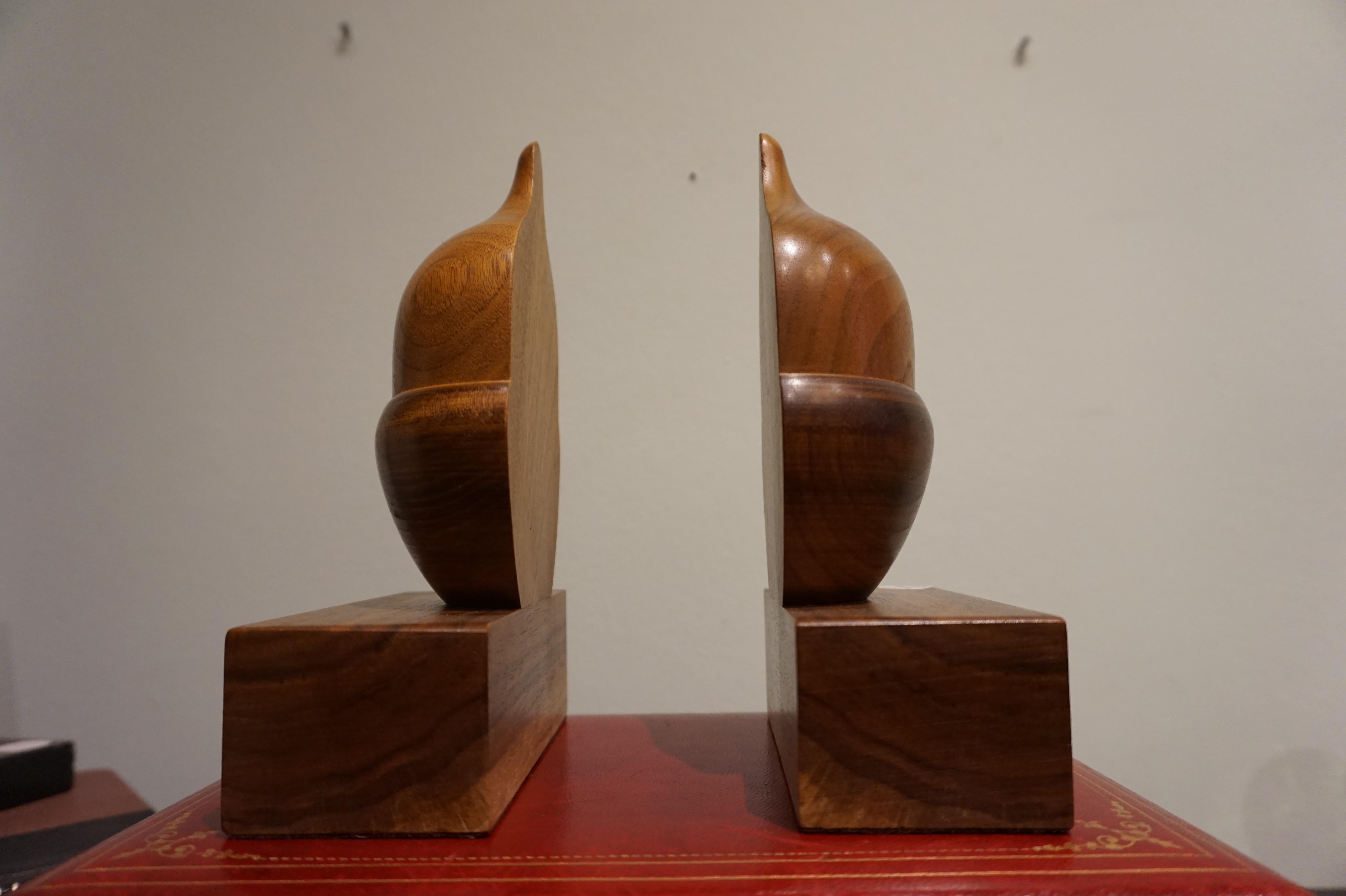 Solid walnut bookends with matching grains. Beautifully hand carved in an acorn shape, midcentury.