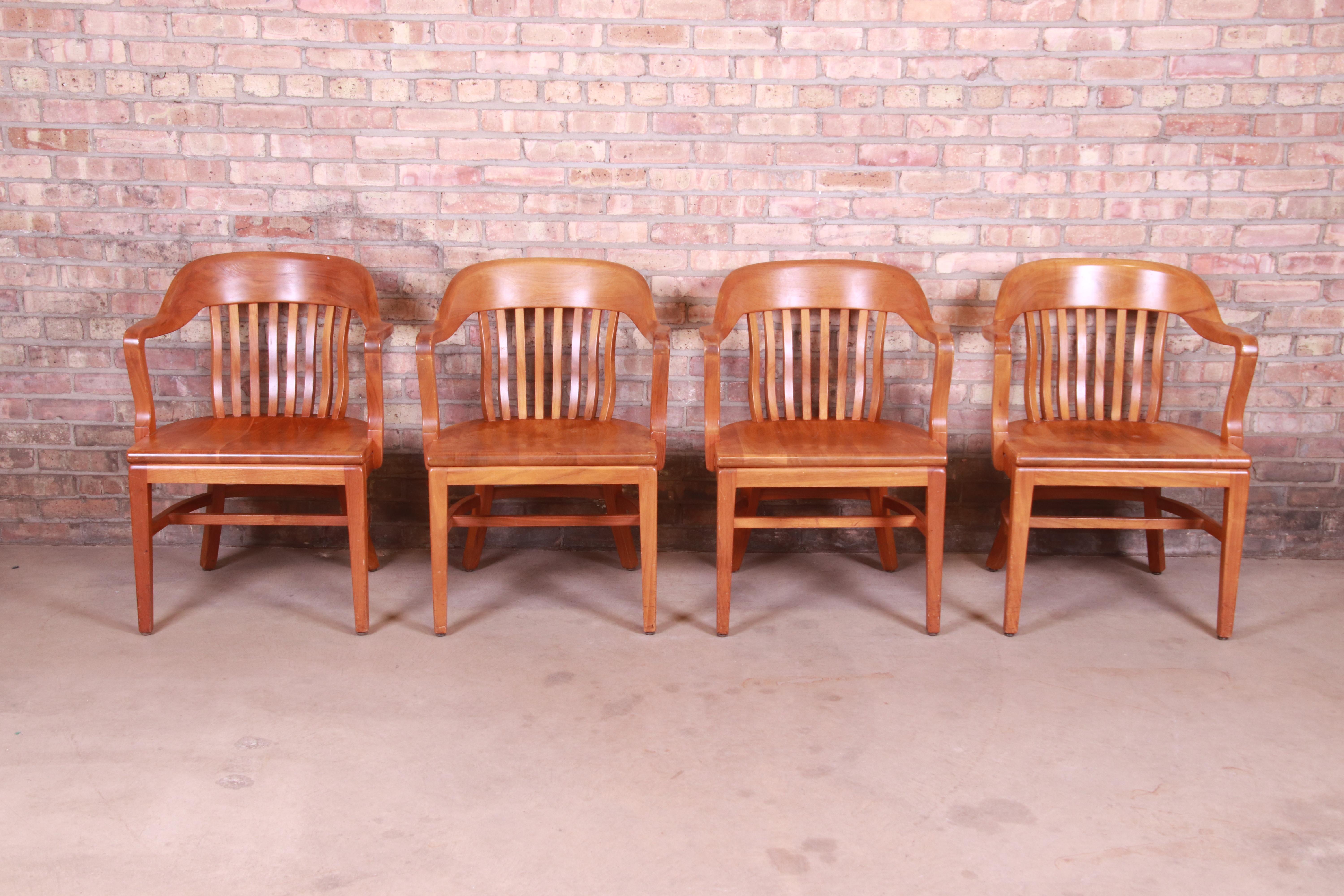 A gorgeous set of four vintage solid walnut banker, juror, or lawyer chairs

By Johnson Chair Co.

Retailed by the Merchandise Mart, Chicago

USA, Circa 1940s

Measures: 24.25