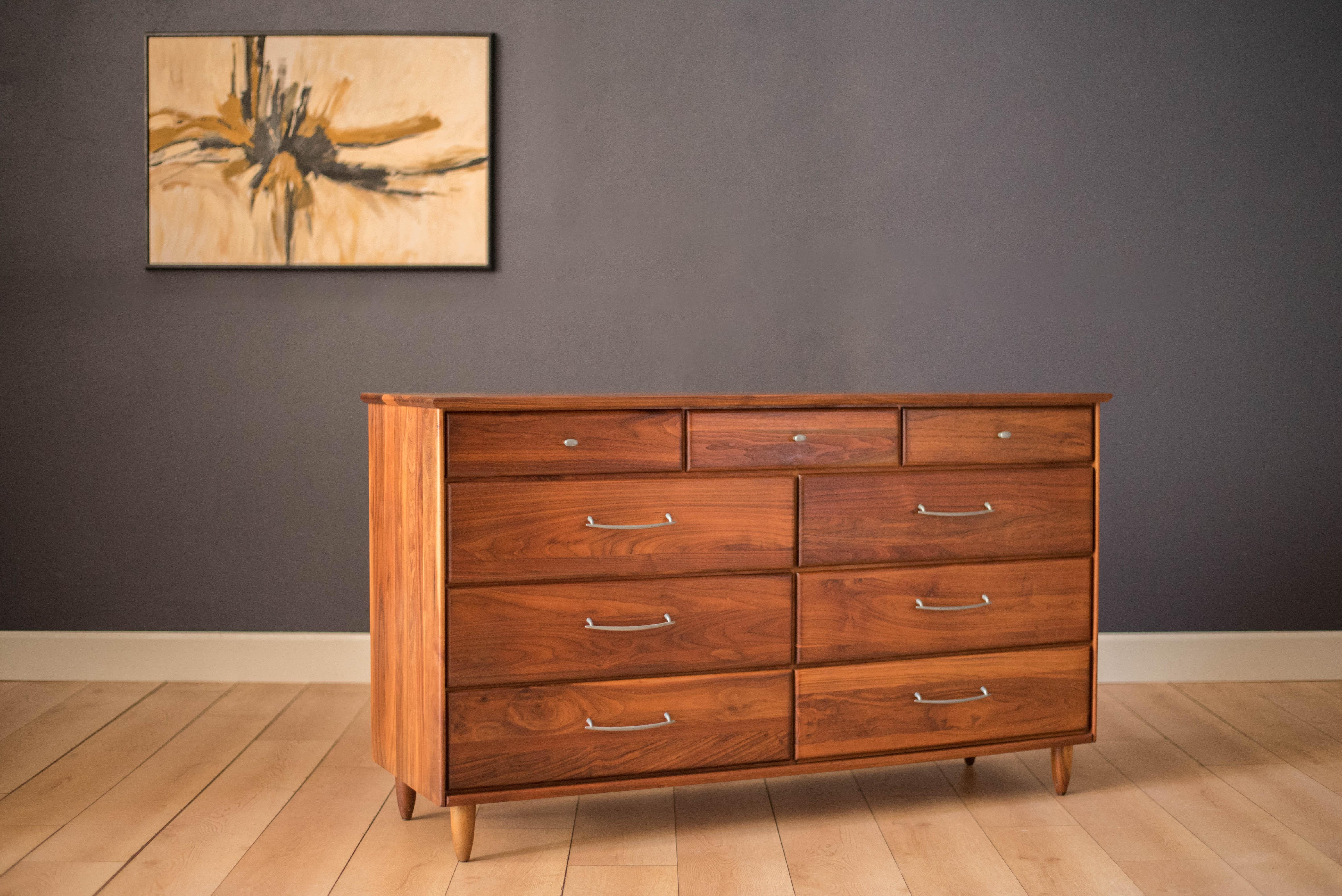 Vintage prelude dresser for ACE-HI Furniture in solid planked walnut. This piece offers plenty of storage and includes nine storage drawers accessorized with pewter pulls.



Offered by Mid Century Maddist