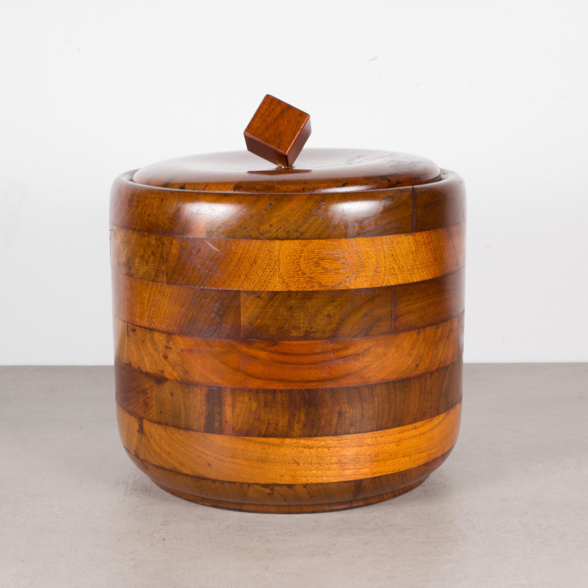 ABOUT

An original mid-century solid Walnut ice bucket with thick silver glass Pyrex insert.

 CREATOR Unknown.
 DATE OF MANUFACTURE c.1950-1960.
 MATERIALS AND TECHNIQUES Solid Walnut, Glass.
 CONDITION Good. Wear consistent with age and