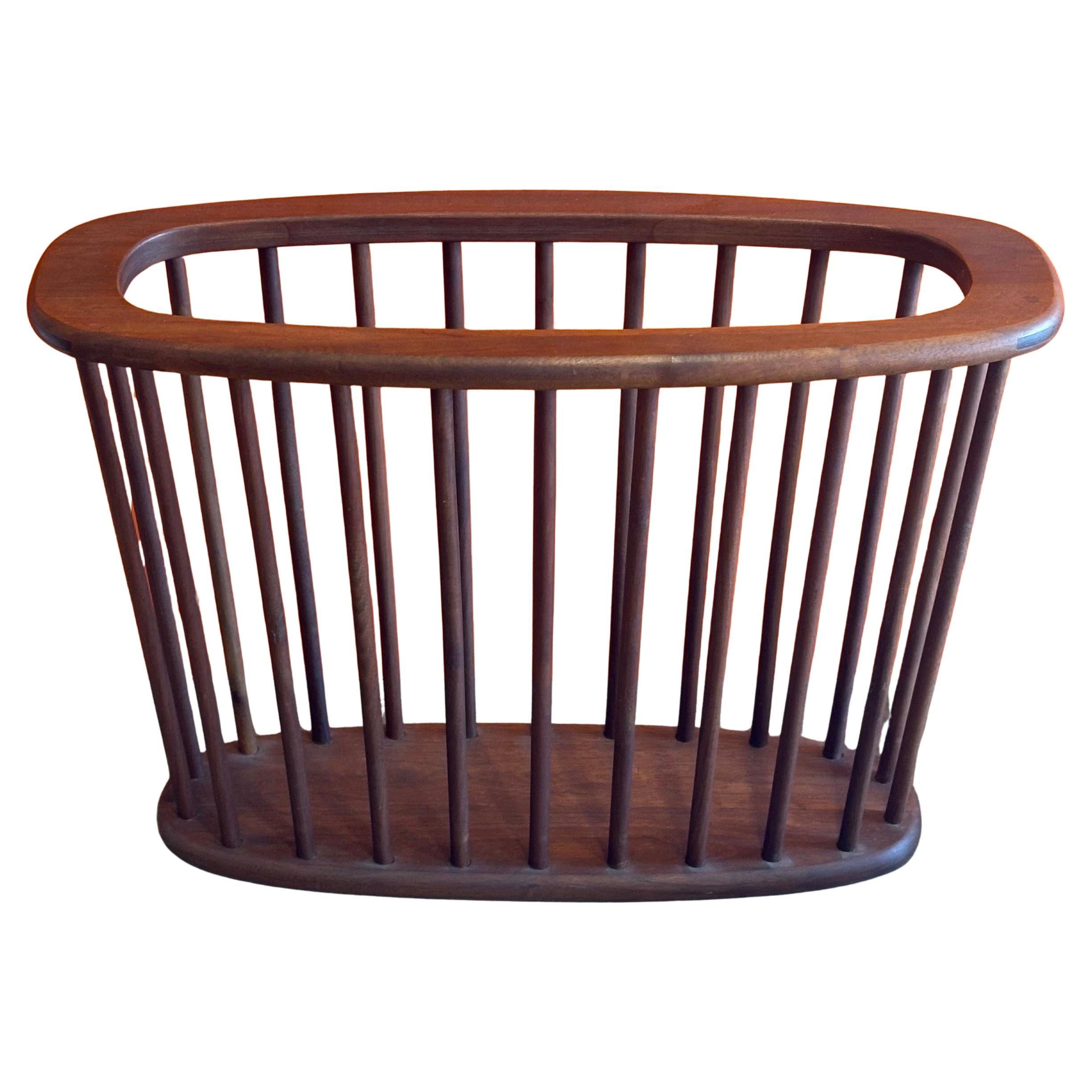 Mid-century solid walnut magazine rack by Arthur Umanoff, circa 1960s. The piece is in very good vintage condition and measures 21