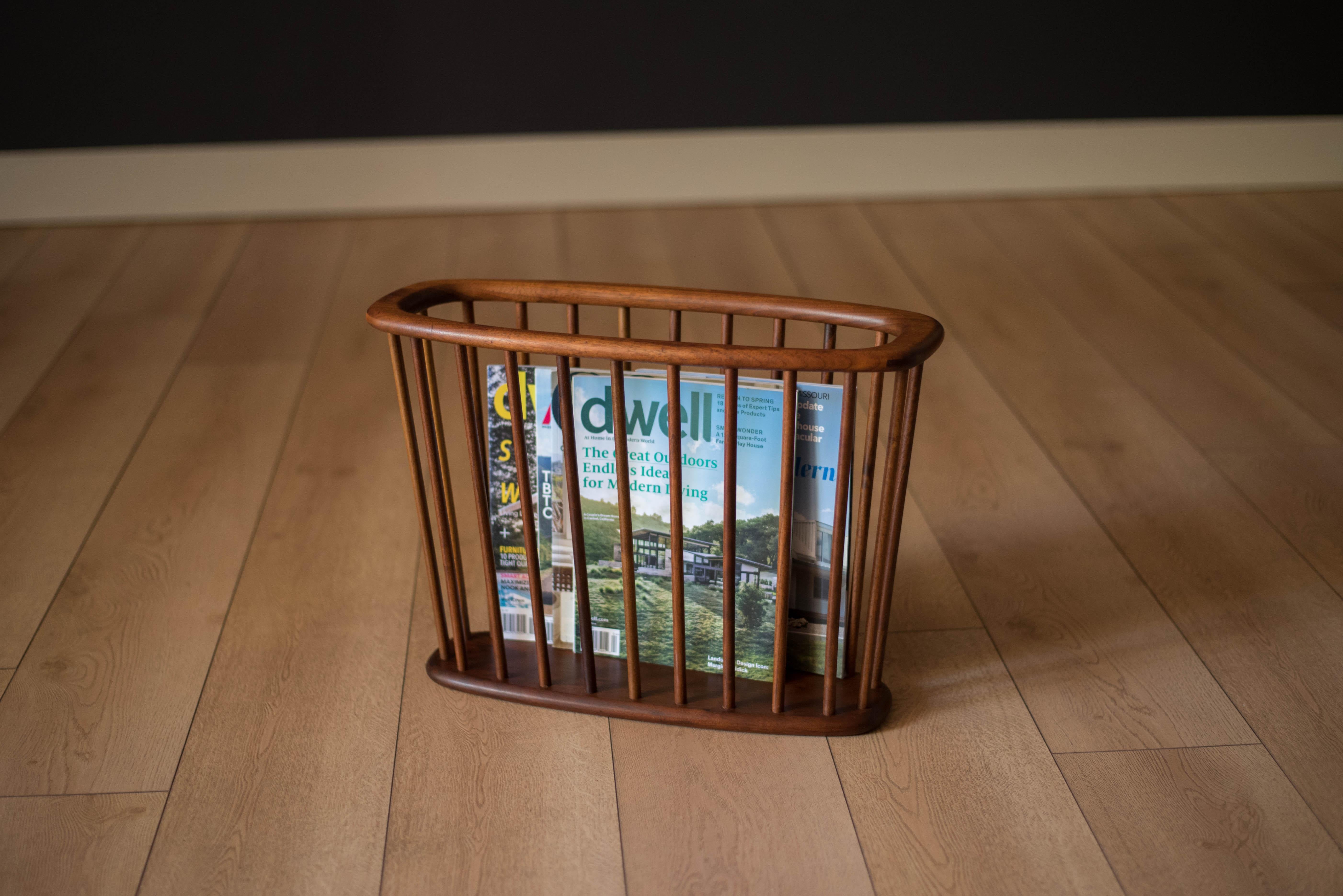 Vintage magazine holder designed by Arthur Umanoff for Washington Woodcraft, circa 1960s. This organizing rack is constructed of solid walnut and is perfect for displaying light reading material.