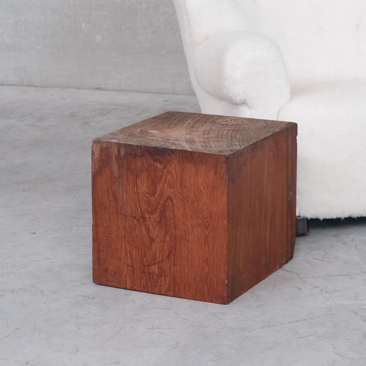 A heavy and distinctly solid wooden square block, ideal for art display or as a side table. 

Belgium, c1960s. 

The wood is perhaps exotic. 

Some scuffs and wear commensurate with age. 

Location: Belgium Gallery. 

Dimensions: 41 W x 41