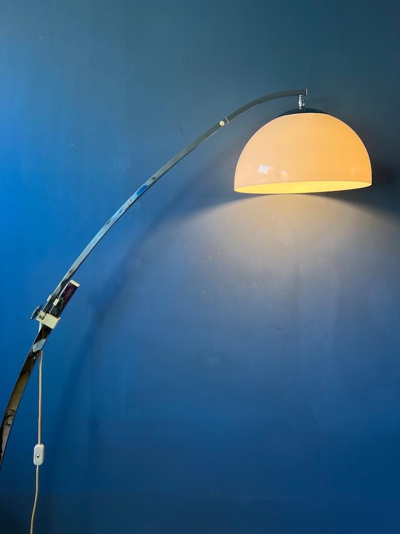 Very rare space age arc floor lamp with mushroom shade by the German Sölken Leuchten. The white shade produces a warm and delicate glow. The height/length of the lamp can be adjusted with its extendable arm. This design allows the lamp to extend