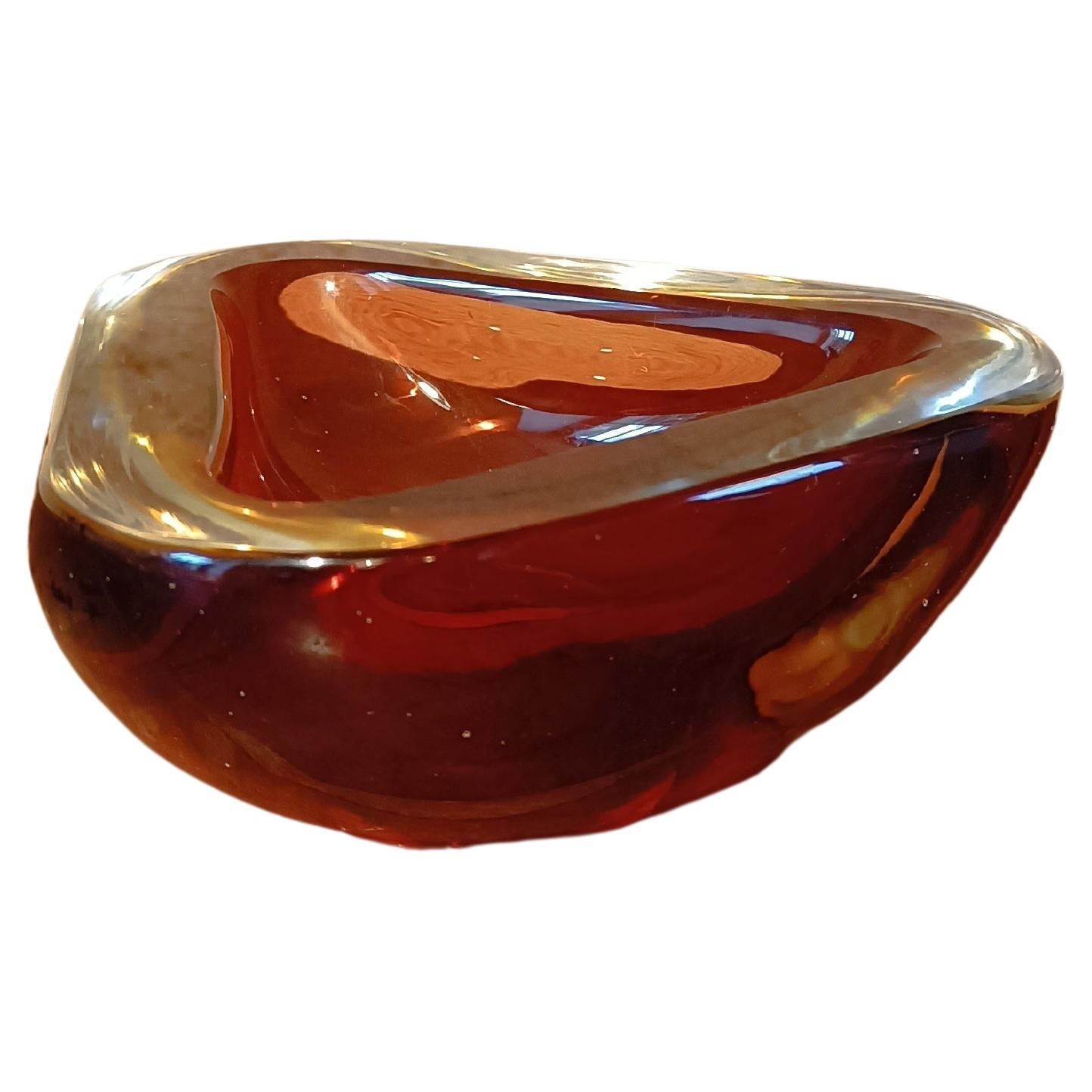 Mid-Century sommerso Murano Glass Ashtray or Bowl, italian design, 1970

This is a beautiful triangular shaped Murano art glass ashtray or decorative bowl. . It is made according to the technique of sommerso which allows to superimpose several