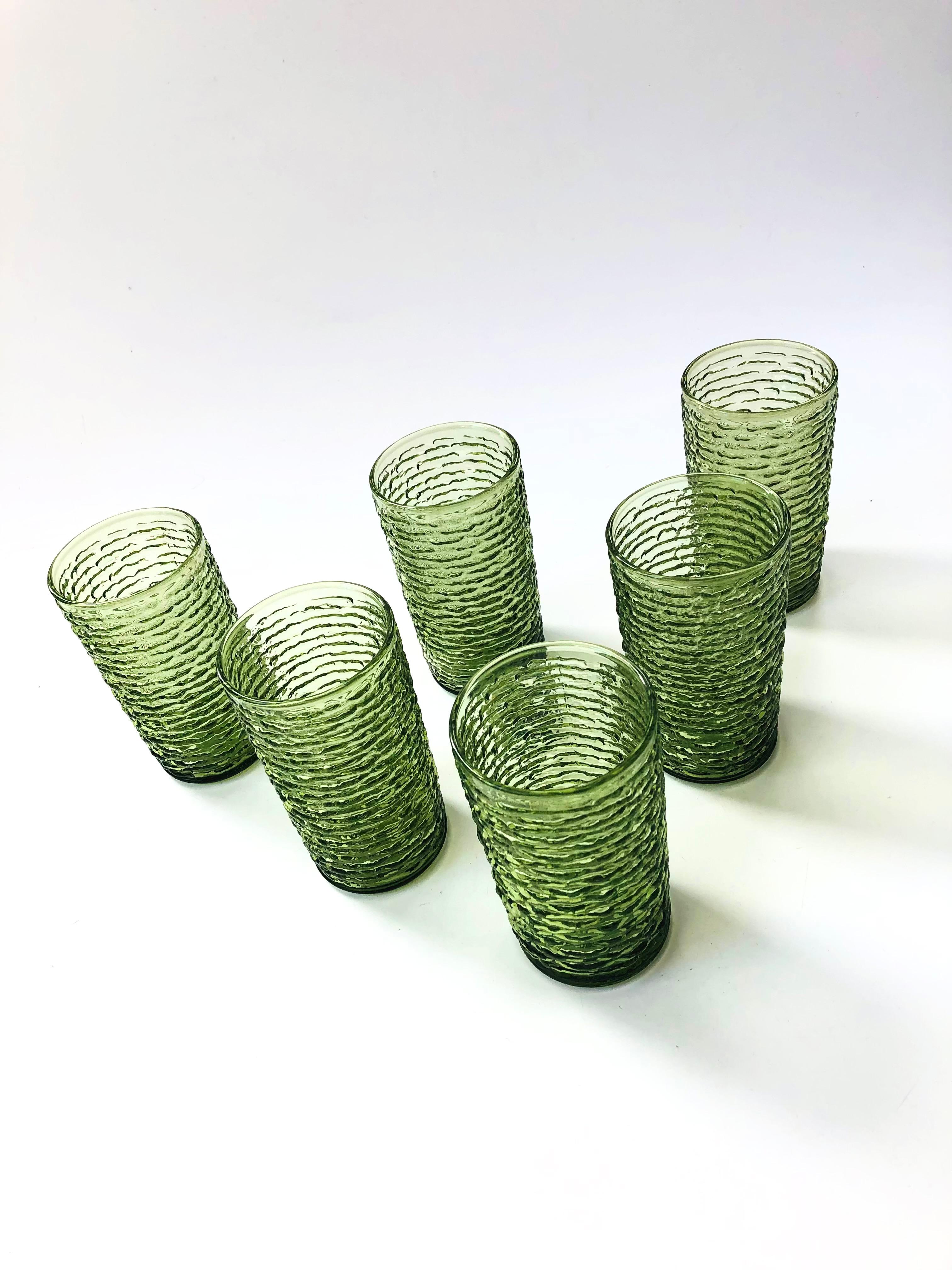A set of 6 mid century highball glasses in textured green glass. Made by Anchor Hocking in the 