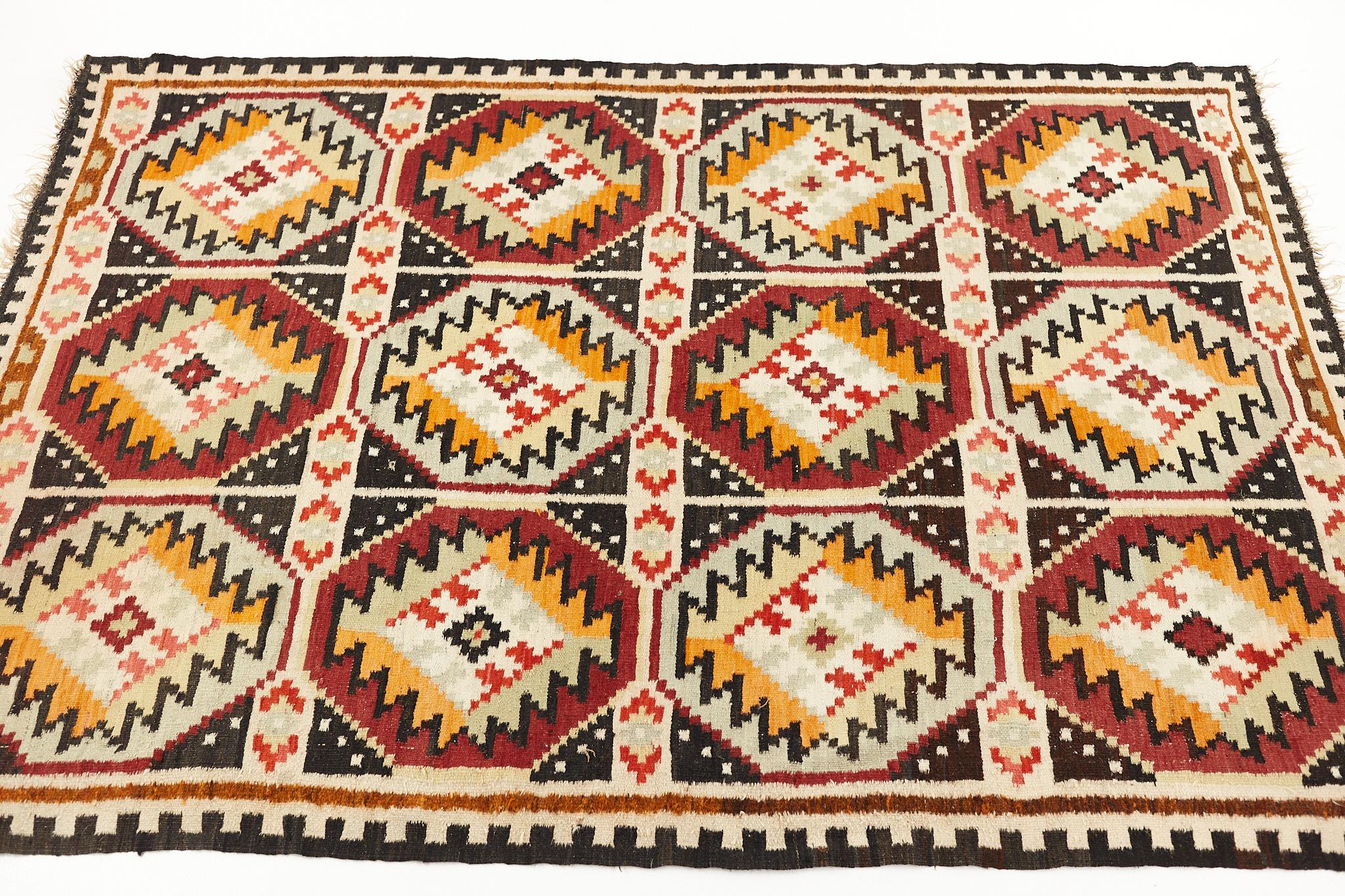 Mid Century Southwest Inspired flat weave wool rug

This Rug is in Good Vintage Condition

This rug measures: 108 wide x 78 inches deep

We take our photos in a controlled lighting studio to show as much detail as possible. We do not photoshop