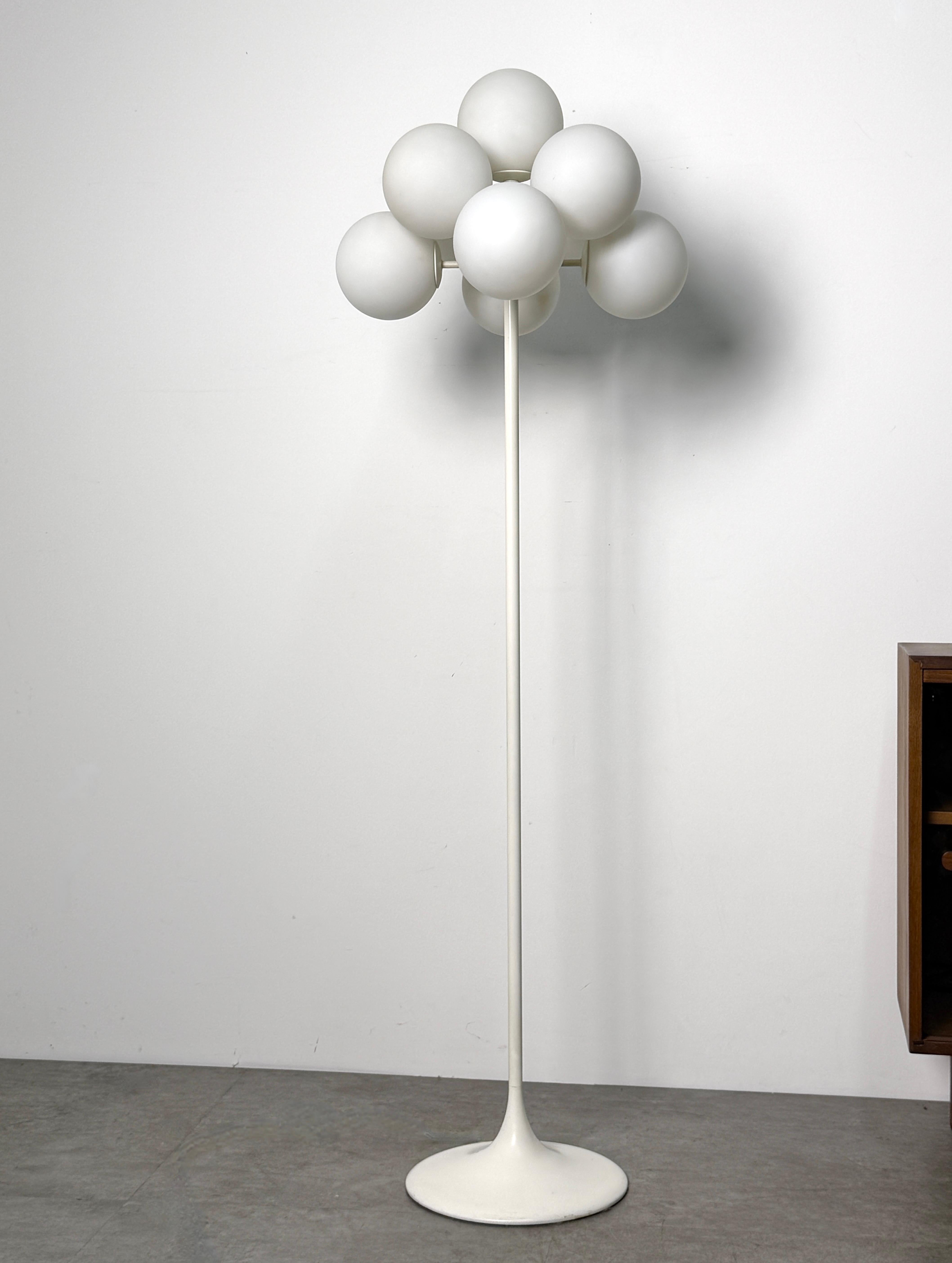 Sputnik globe floor lamp designed by Eva Renée Nele for Temde Leuchten
Switzerland circa 1960s

From the Figuration line, this lamp features a heavy enameled steel tulip base and 9 white Opaline glass globe shades

Overall diameter 19 inches
Height