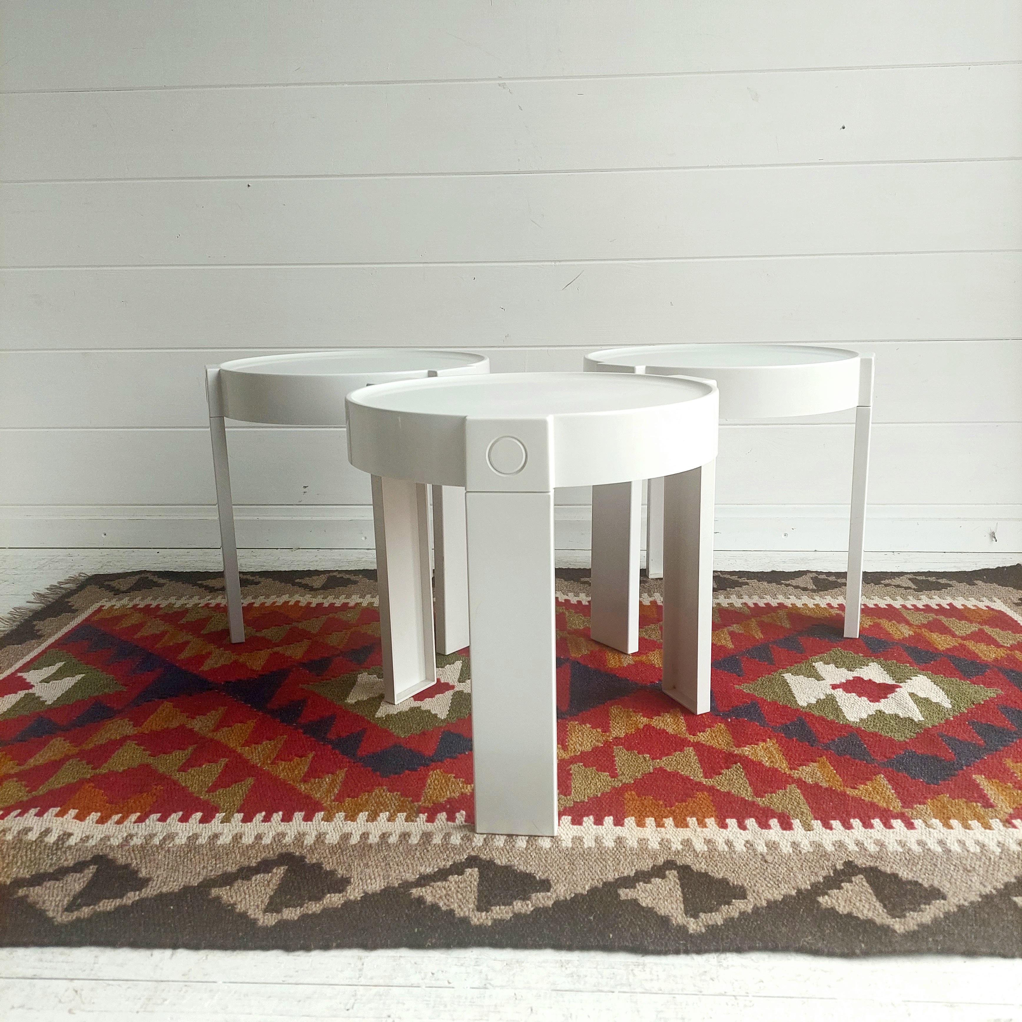 Set of 3 1960's /70's retro tables in white plastic, 
Very reminiscent of Crayonne and Kartell. 
Small stackable nesting tables from the 70s. Engraved 