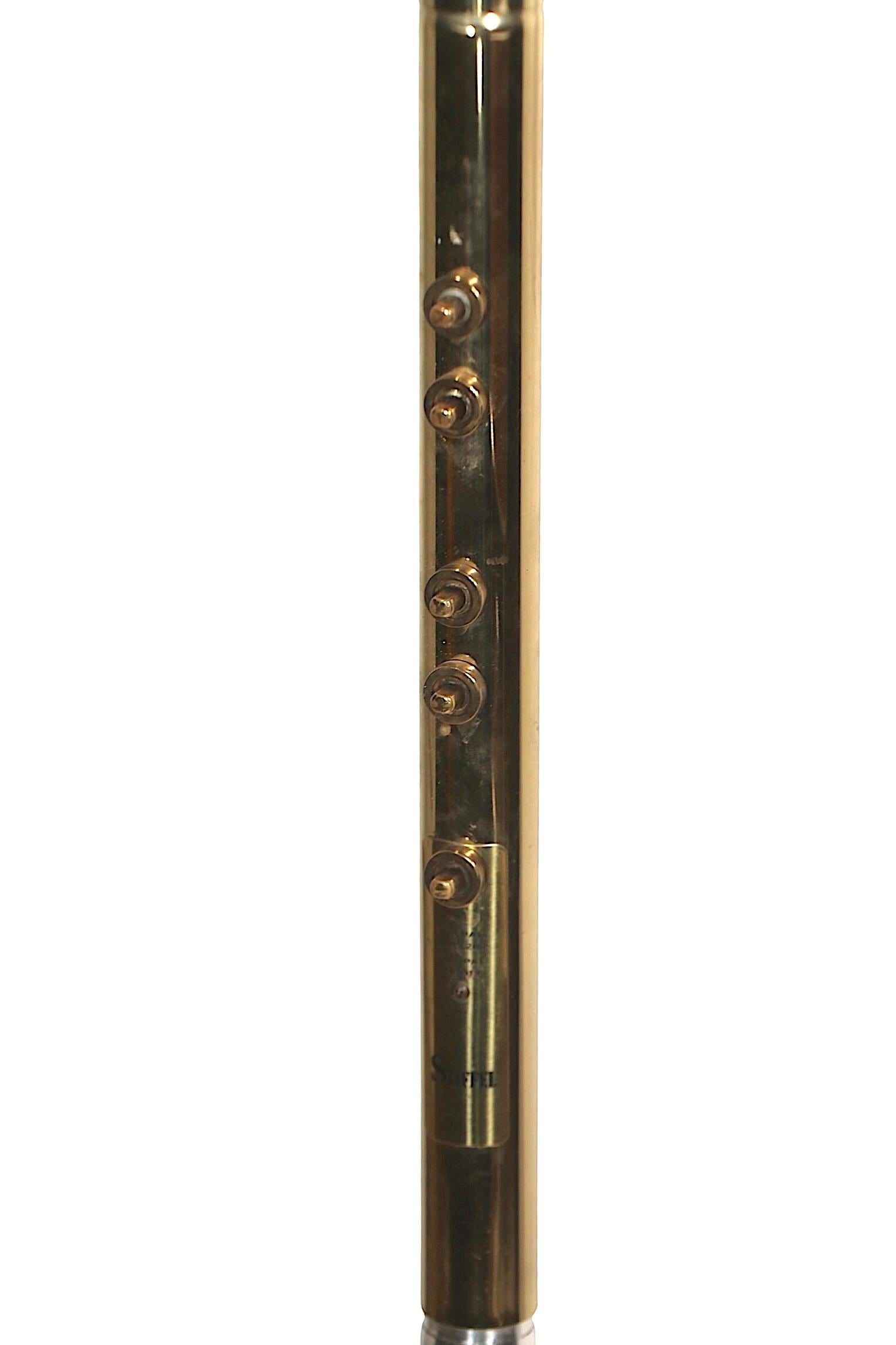 Rare Mid Century, Space Age tension pole floor lamp, made by Stiffel designed attributed to Raymond Loewy. This model, known as the 