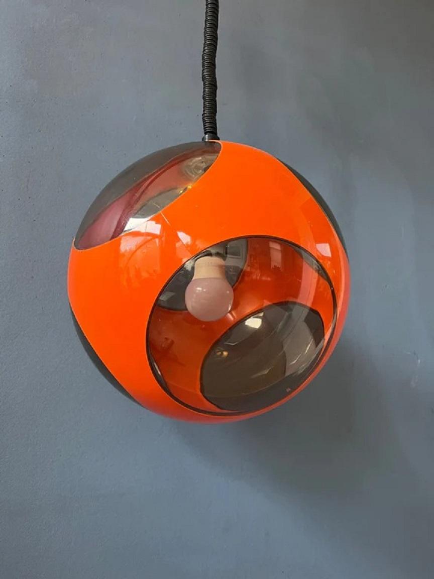 Iconic orange bug eye pendant lamp by Massive, often attributed to Luigi Colani.The lamp requires one E27/26 lightbulbs.

Dimensions: 
ø: 28 cm
Height (shade): 28 cm

Condition: Good. The lamp has a few vague scratches here and there. There is on