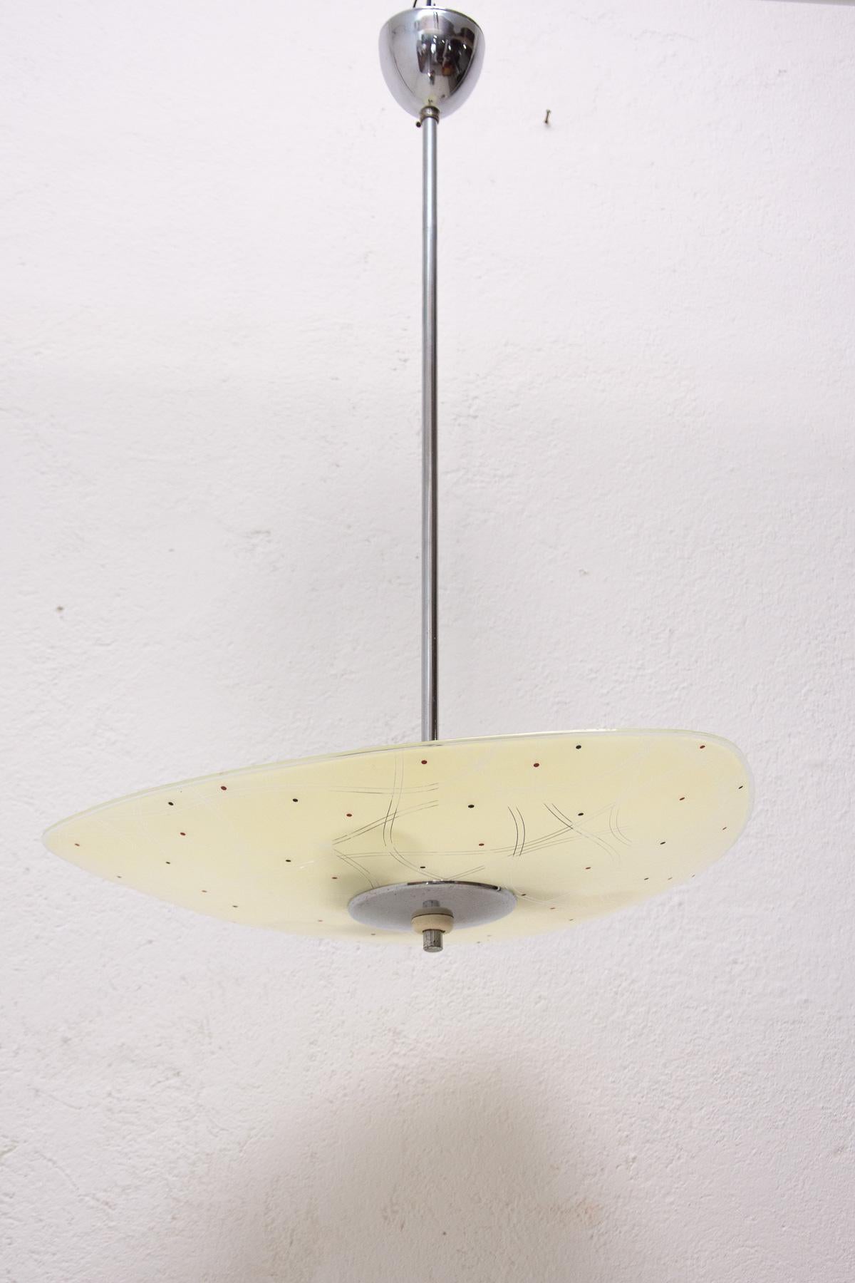 Mid century space age chandelier from the turn of the 50s and 60s connected with the exhibition EXPO 58 in Brussels. Awesome design. Painted motifs. Chrome-plated rod. In very good condition, new wiring.

Lamp shade: 7 cm.