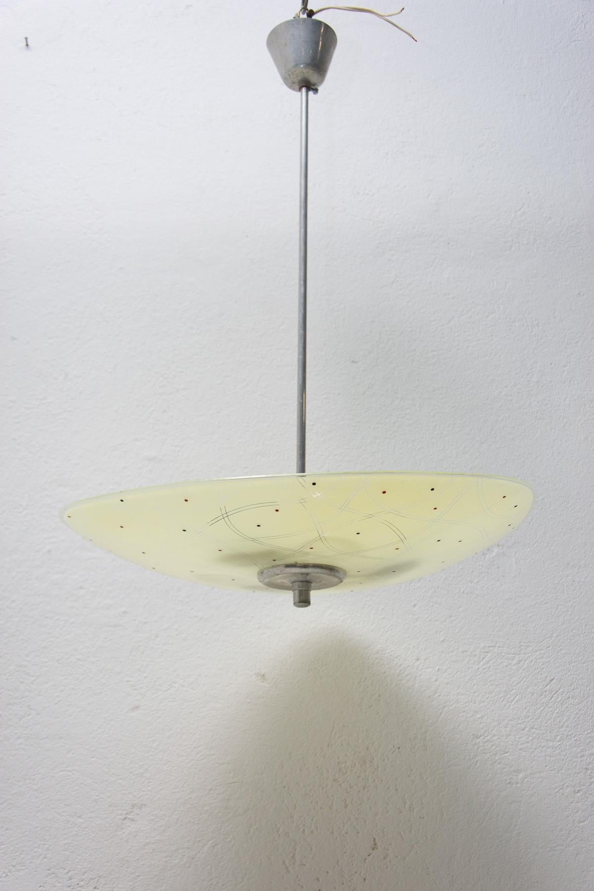 Mid century space age chandelier from the turn of the 50s and 60s connected with the exhibition EXPO 58 in Brussels. Awesome design. Painted motifs. Chrome-plated rod. In very good condition, new wiring.

3 E27 bulbs, Up to 250