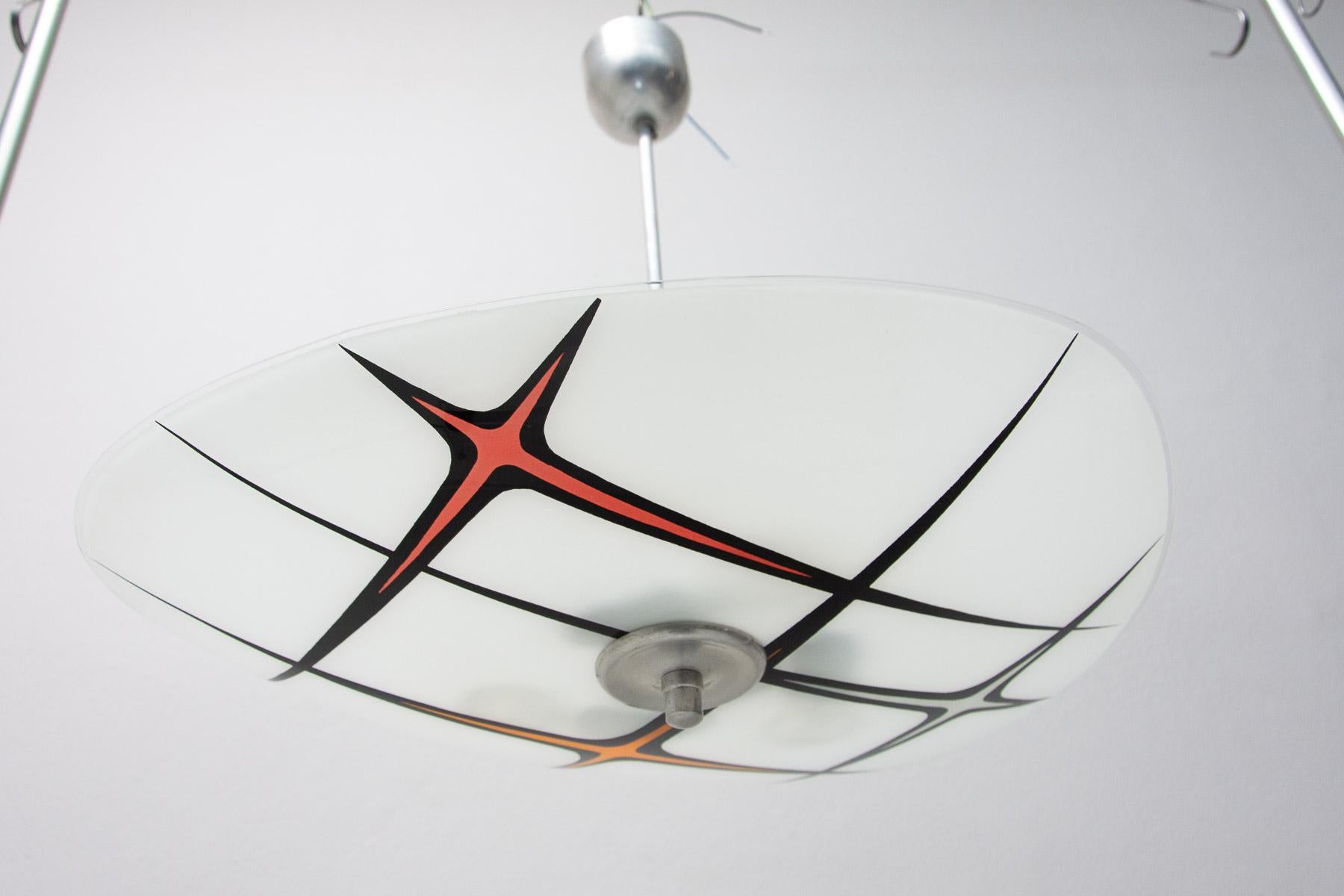 Mid century space age chandelier from the turn of the 50s and 60s connected with the exhibition EXPO 58 in Brussels. Awesome design. Painted motifs. Chrome-plated rod. In very good condition, new wiring.

3 E27 bulbs, Up to 250