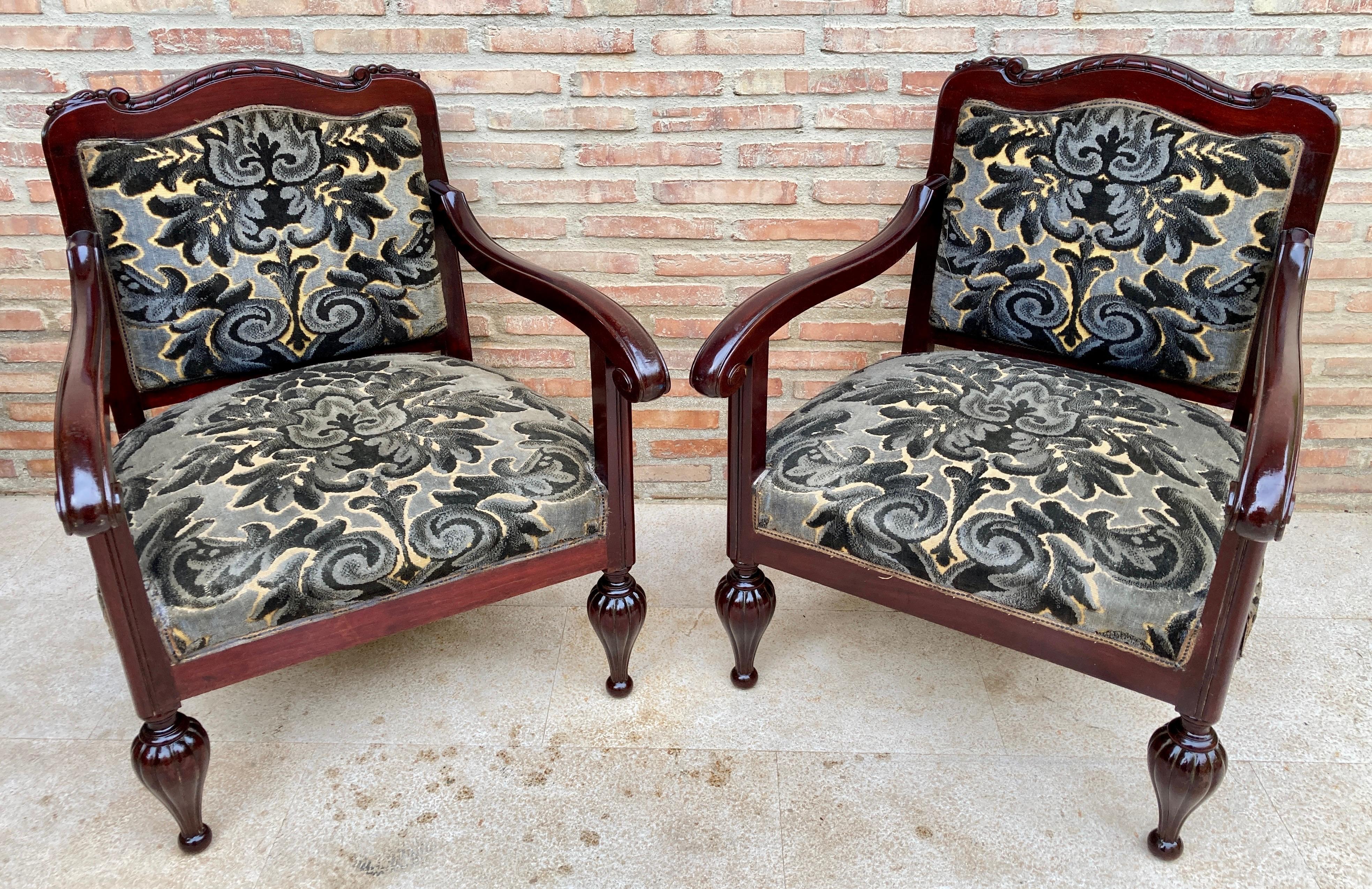 The shape of this pair of classic Mid Century armchairs is simply fabulous with its beautiful wooden legs on the front, arms and back and seat. The back and seat of this armchair are made of velvet fabric with leaf and flowers details.