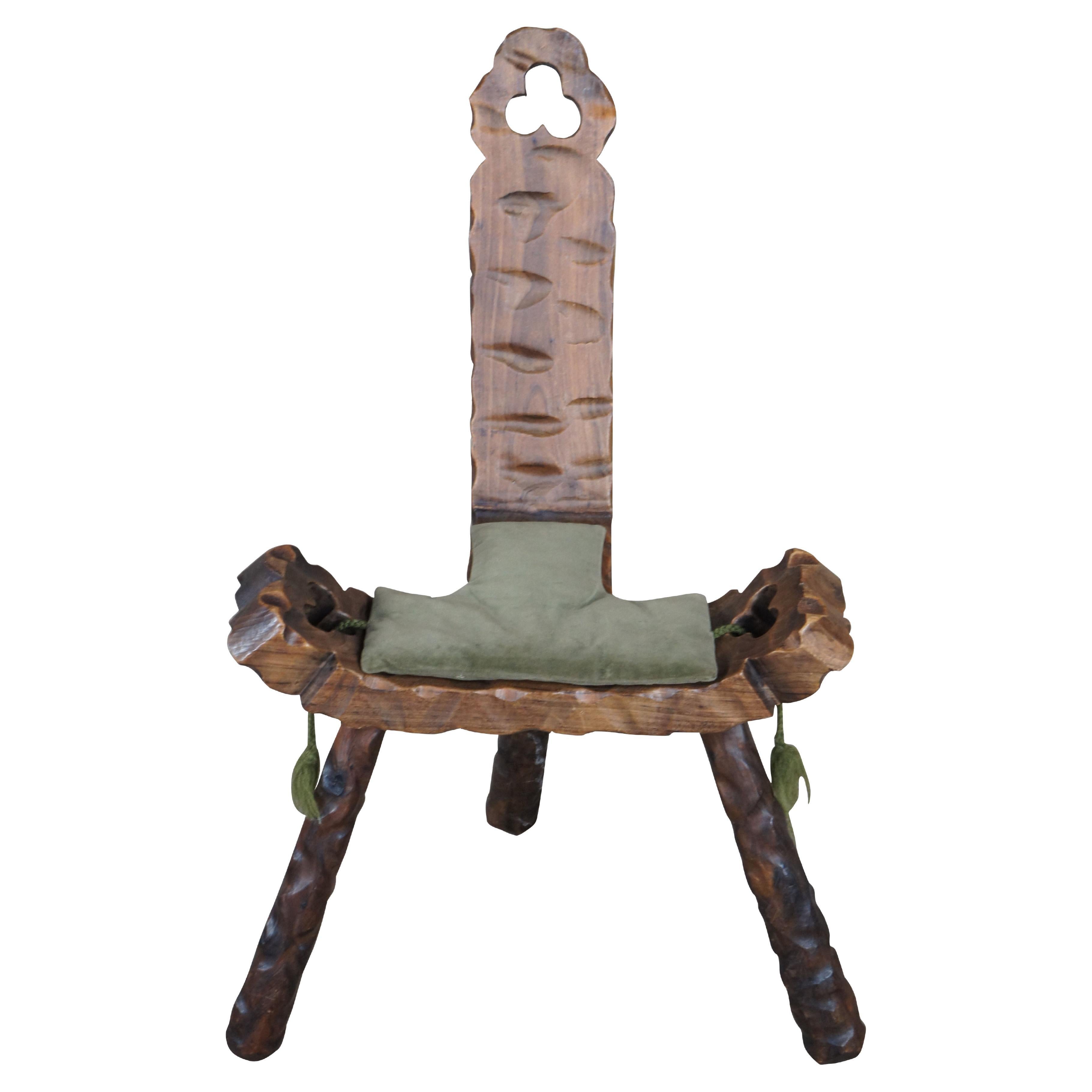 Mid century circa 1950s Spanish birthing stool or chair.  Made of walnut featuring carved brutalist design with clover shaped cutouts, two handles / arms, and tripod base.

Dimensions:
18.5